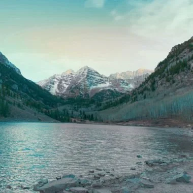 Maroon Bells Lake in Colorado at sunrise offering calming and relaxation.