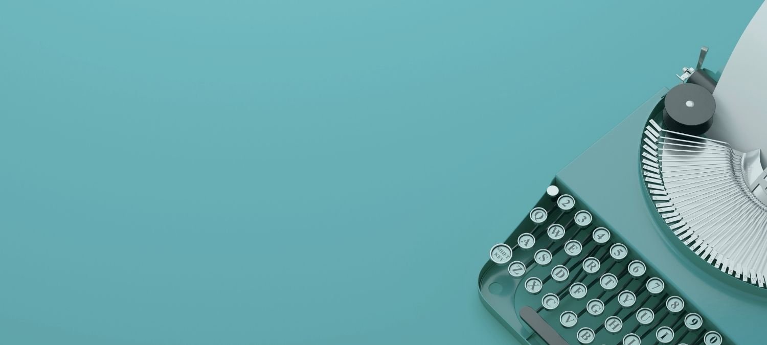 Vintage teal typewriter on a teal background, representing media features, press mentions, and mental health articles by Alexis Verbin at Wellcore Healing.