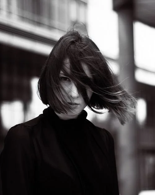 Black and white photo of women in tech walking to therapy in work attire.