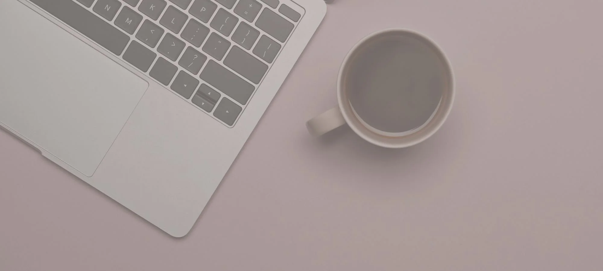 Laptop and coffee on professional desk workspace