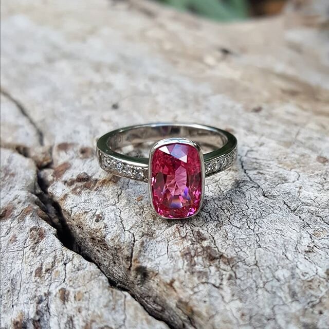 Rare high grade hot pink Spinel in diamond set platinum ring