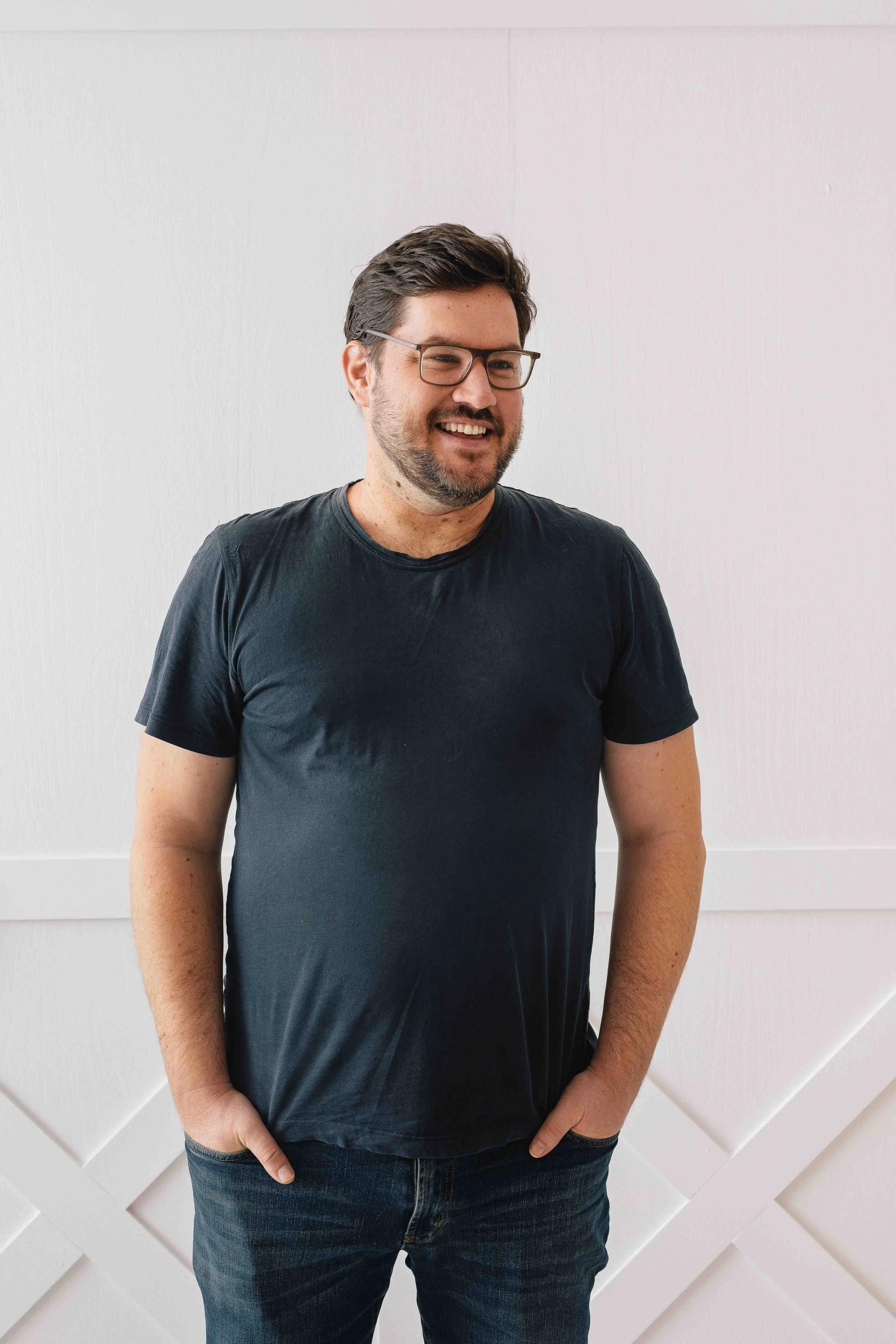 natural headshot of a man in a relaxed studio setting