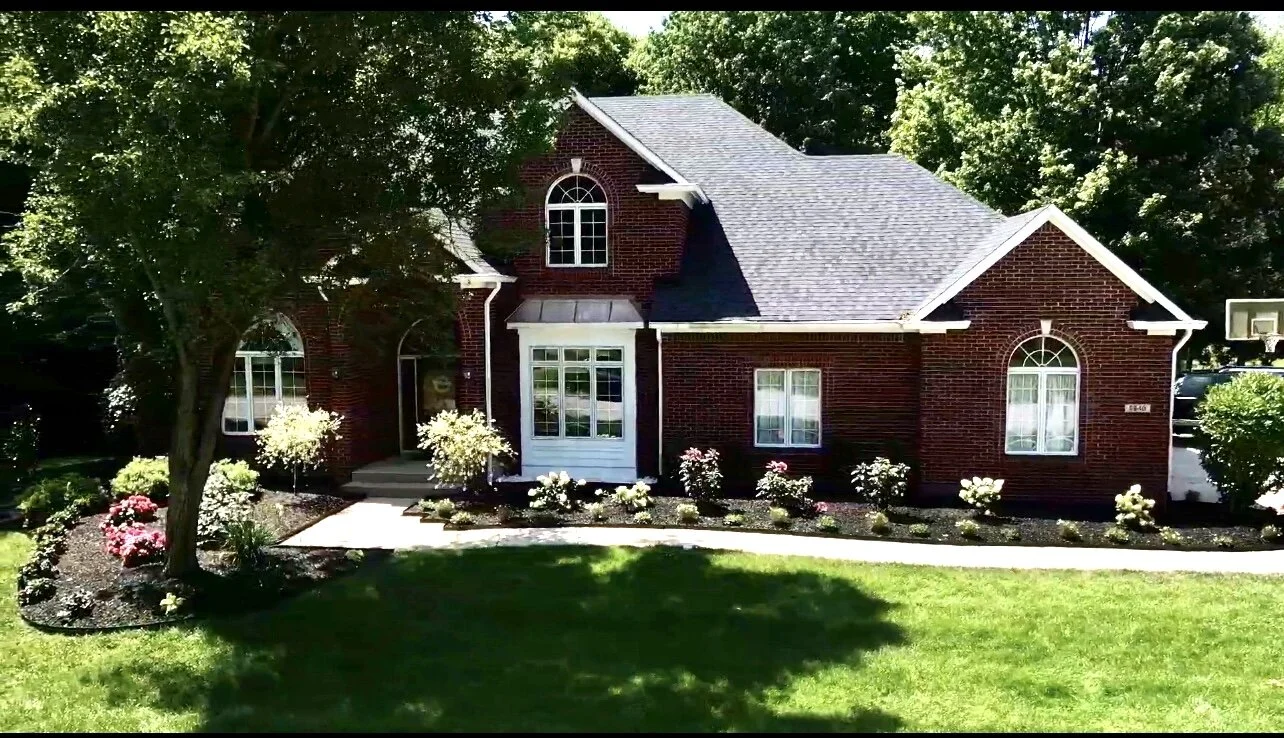 Redesigned front of house flower beds