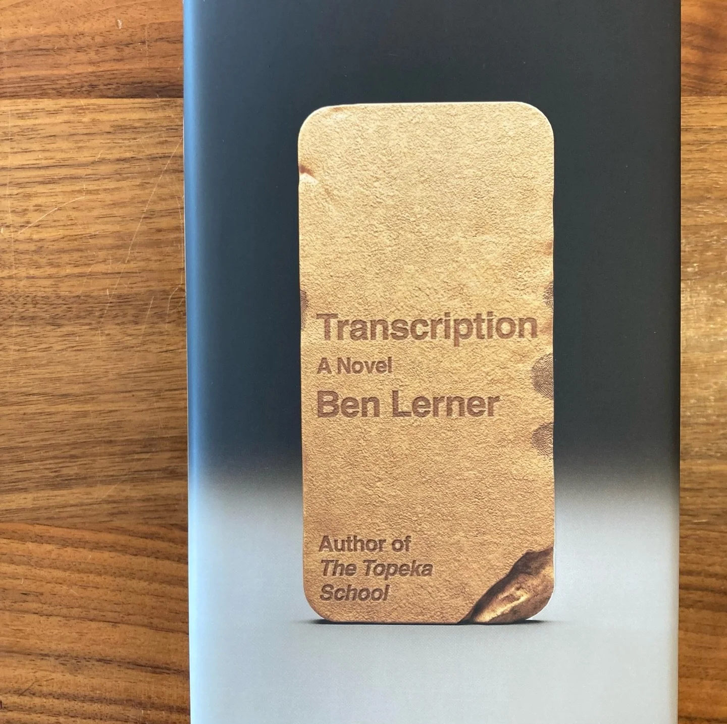 It is difficult to describe this slim bit of exquisite prose. The commentary on Lerner's writing almost always lands on comparisons to Hemingway's exactness and Kafka's surrealism, but what we read, simply put, was a wry story about the smartphone's 