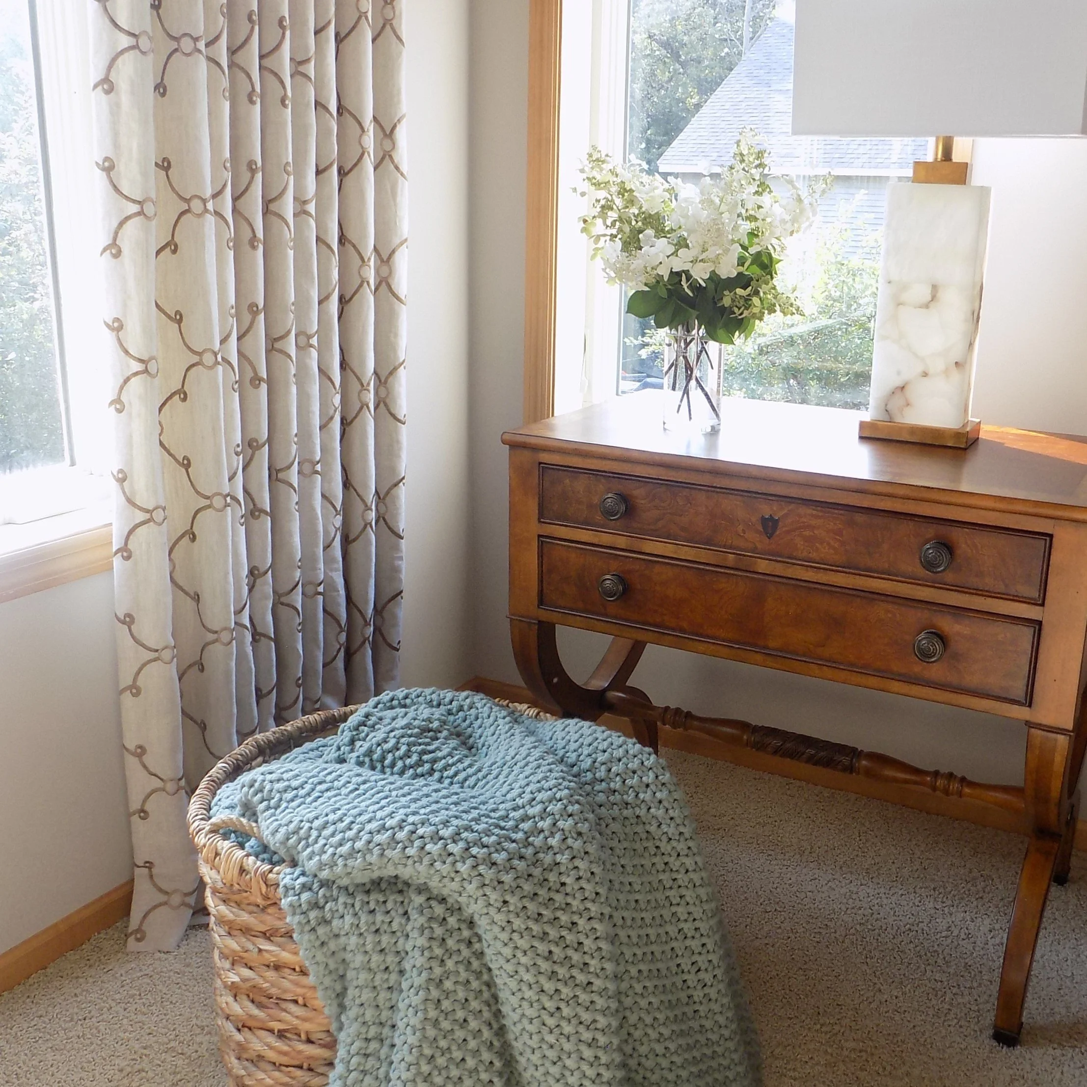 A cozy throw and drapery panels add warmth to this Primary bedroom by Right Side Out Designs based in the Minneapolis area..JPG