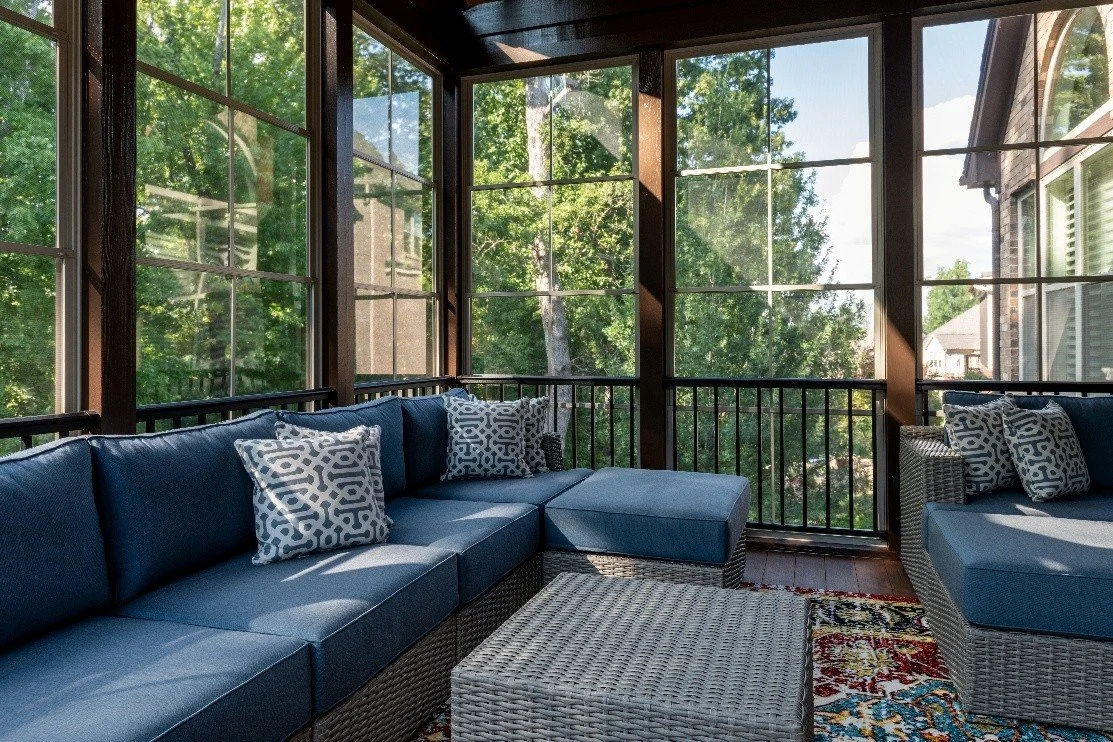 Sunroom with blue grey sofa set and center table
