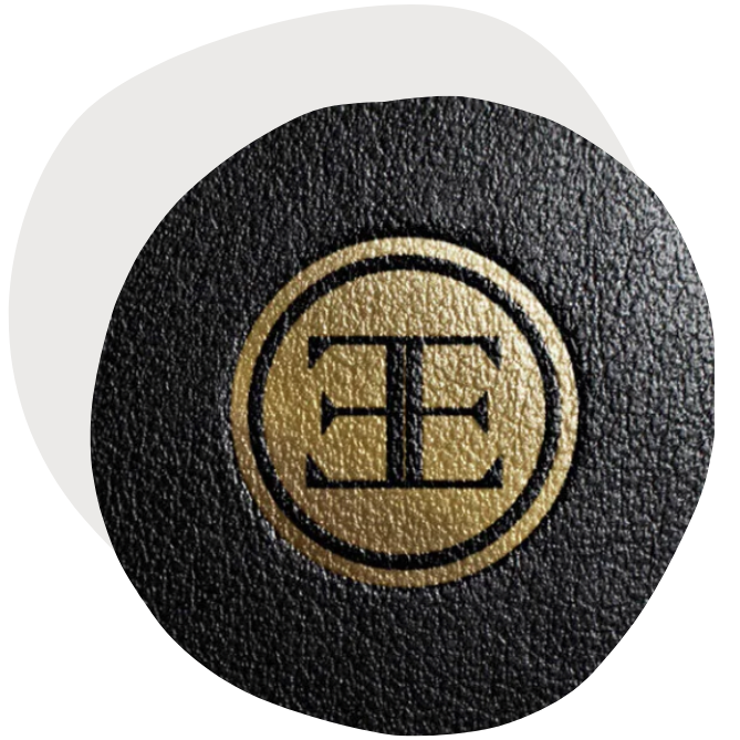 Logo badge with two letter "E" in gold on a black background