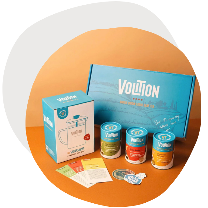 Product table shot of 3 tea tube packaging with box mailer design