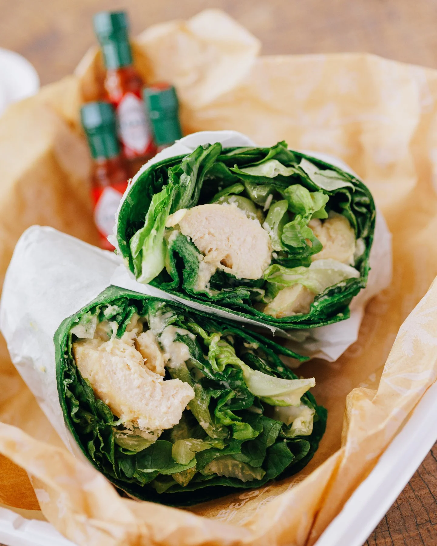 Grab one of our wraps listed below for the road!

CAJUN MAHI WRAP
Seasoned Mahi Mahi, Asian slaw, shredded cheese, chipotle aioli, pico de gallo, tortilla

CHICKEN CAESAR WRAP *Pictured 📷
Grilled chicken, romaine, shredded Parmesan cheese, caesar dr