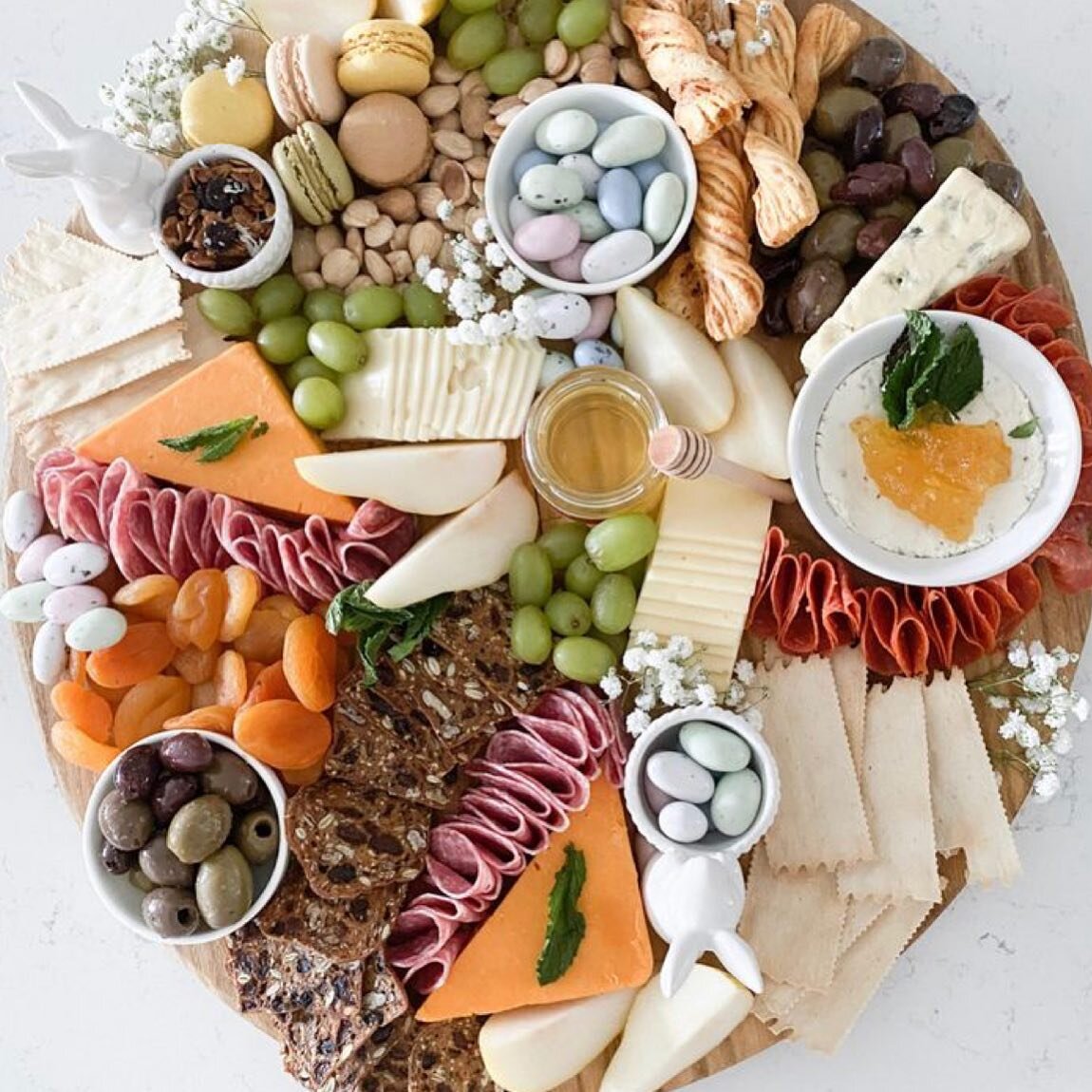 Serve this beautiful east charcuterie board with a western quiche for Easter brunch. A great way to enjoy time together.