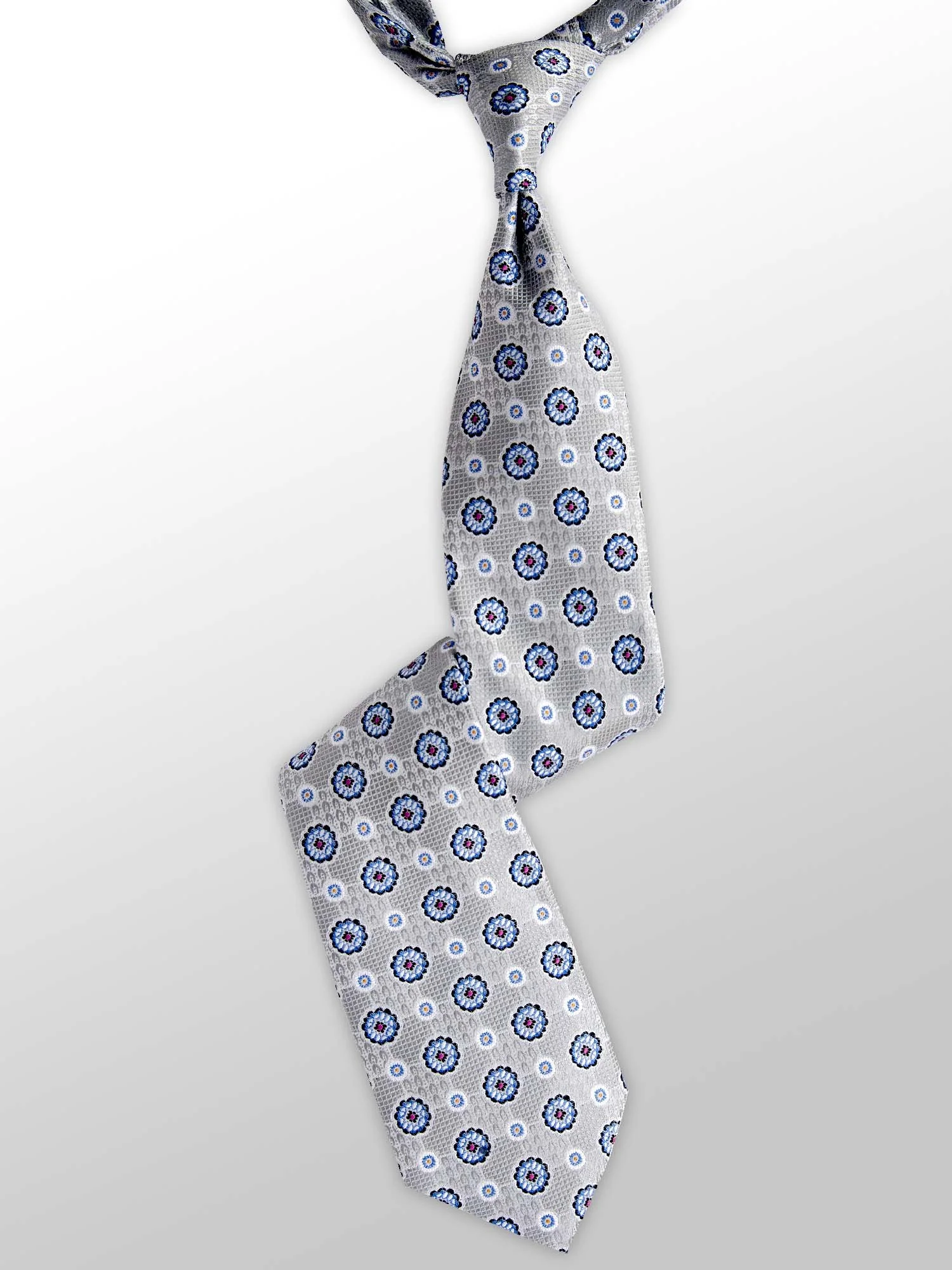 A light gray tie with a blue and white floral pattern, tied in a knot, hanging against a plain white background.