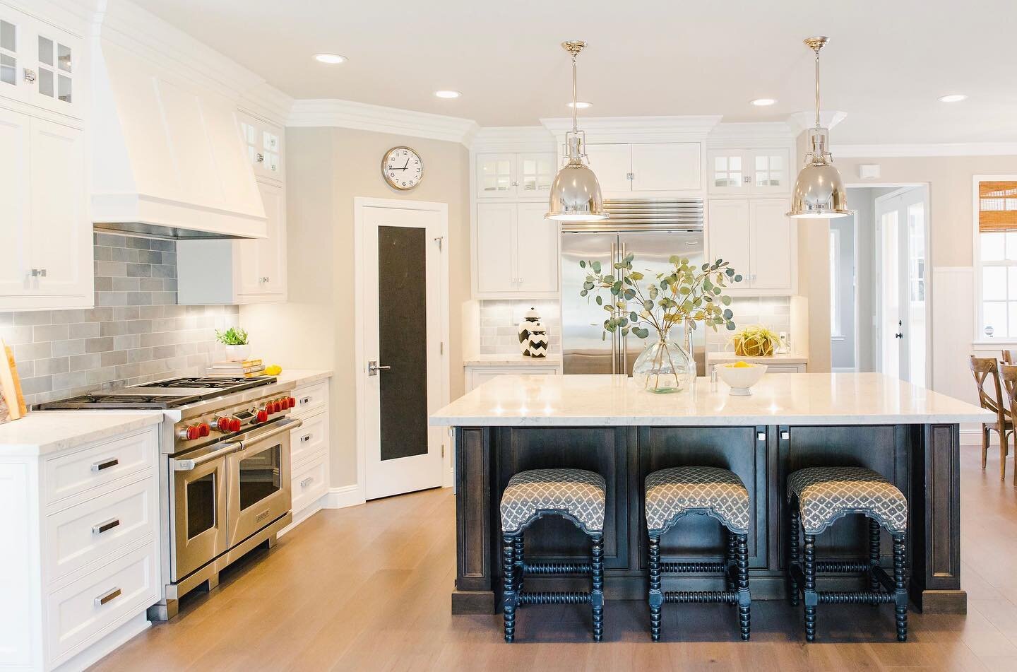 An oldie but goodie on this flashback Friday!
Updated a very 90&rsquo;s situation while still keeping some traditional elements to remain cohesive with the rest of the home. Our favorite part is the @walkerzanger backsplash, which is a marble tile ca