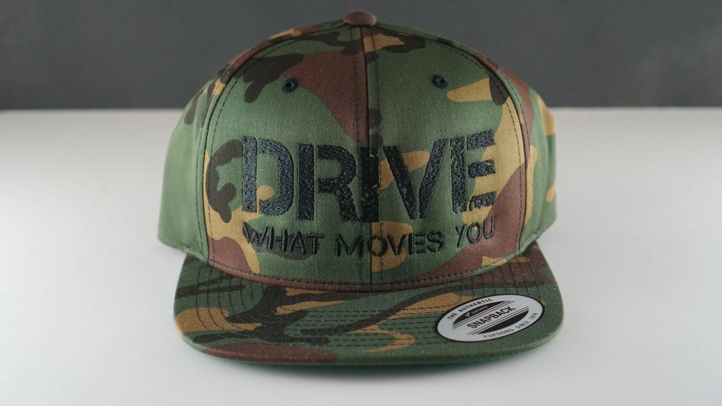 "DRIVE what moves you" Camo Snapback hat Black Logo