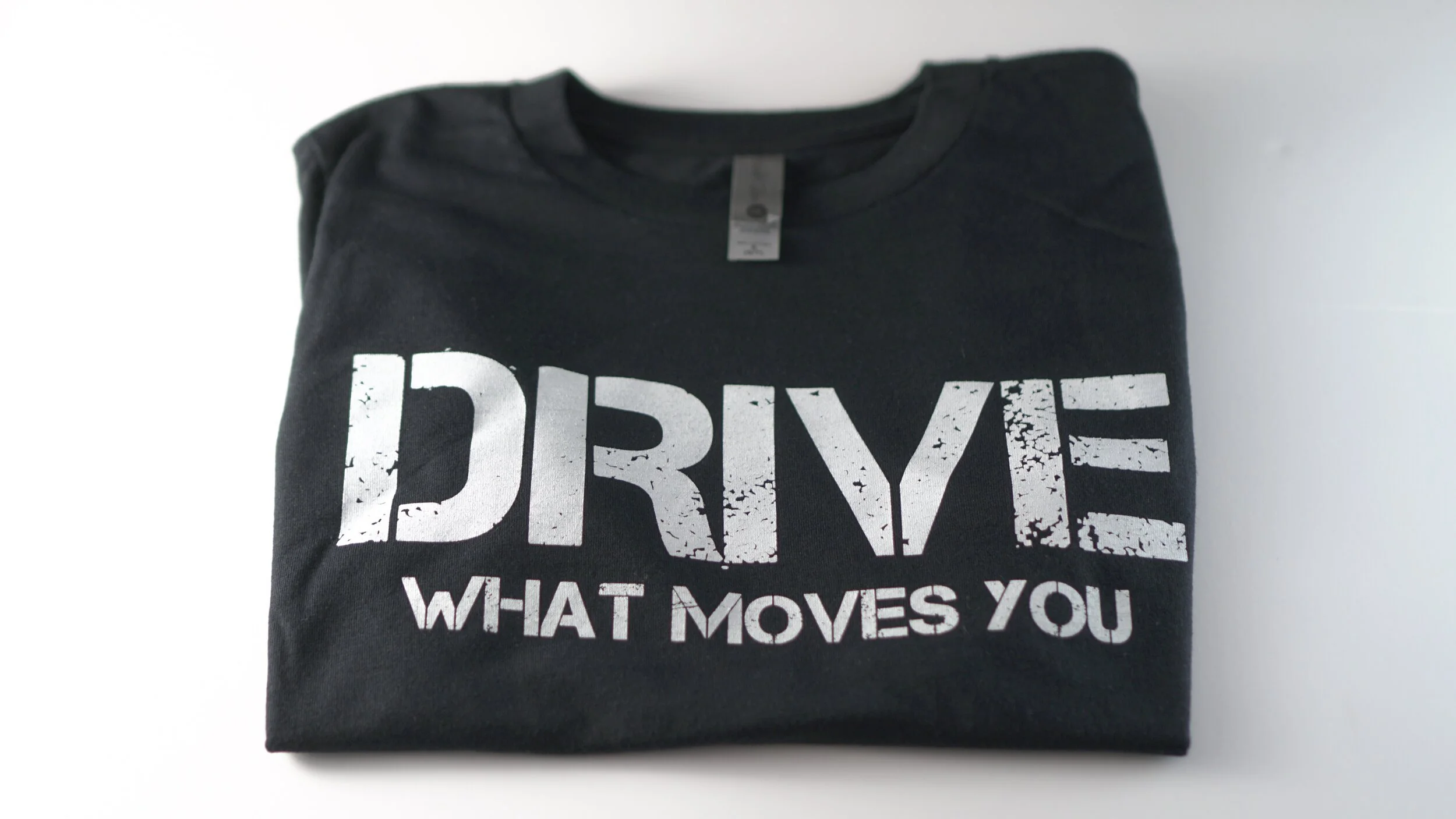 "drive what moves you" YOUTH inspirational tee shirt "WHITE" logo
