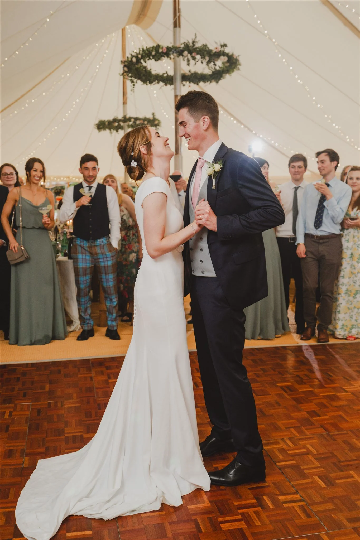 Wedding couple first dance at marquee wedding