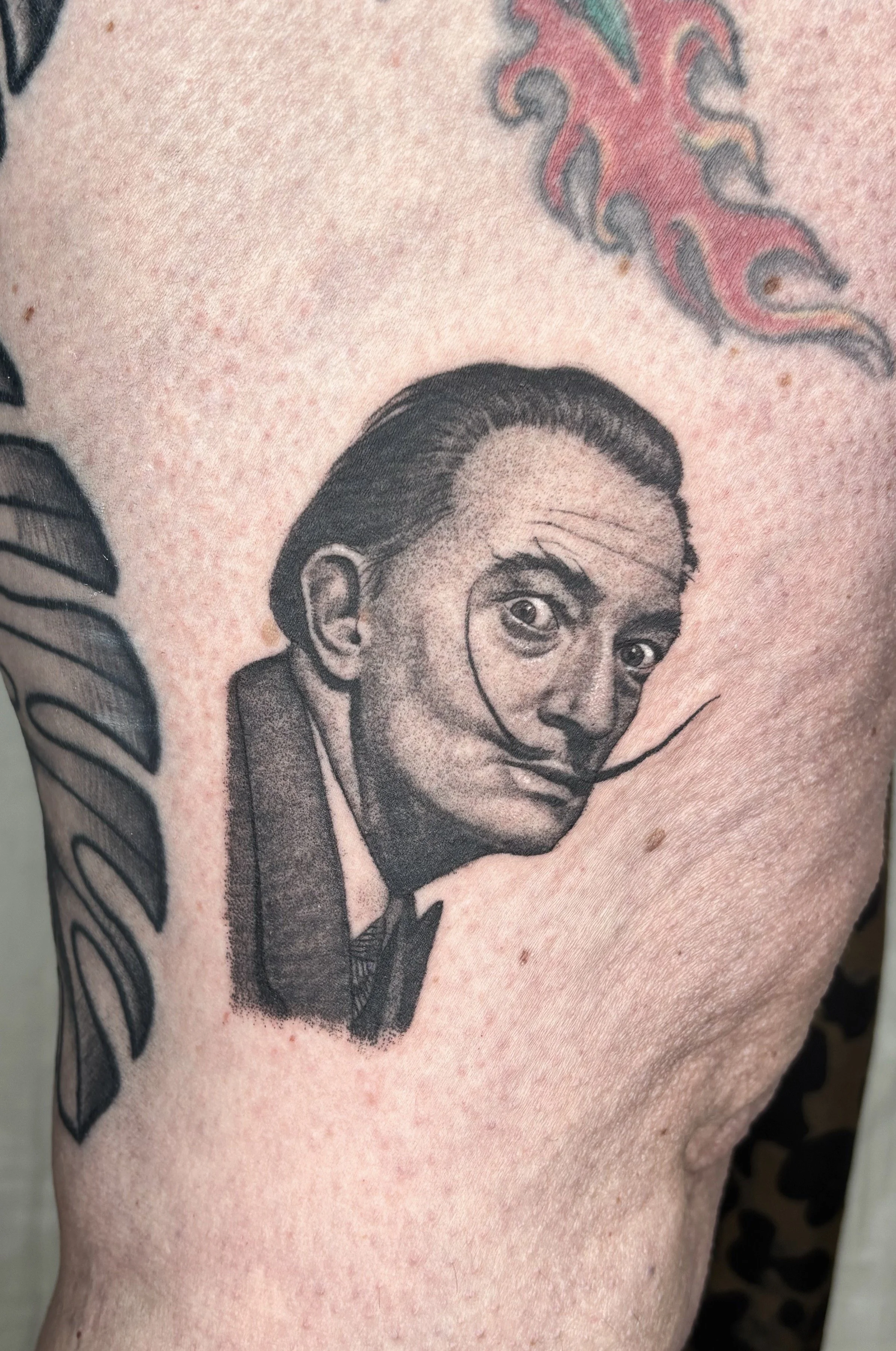 Realistic  Salvador Dali portrait tattoo