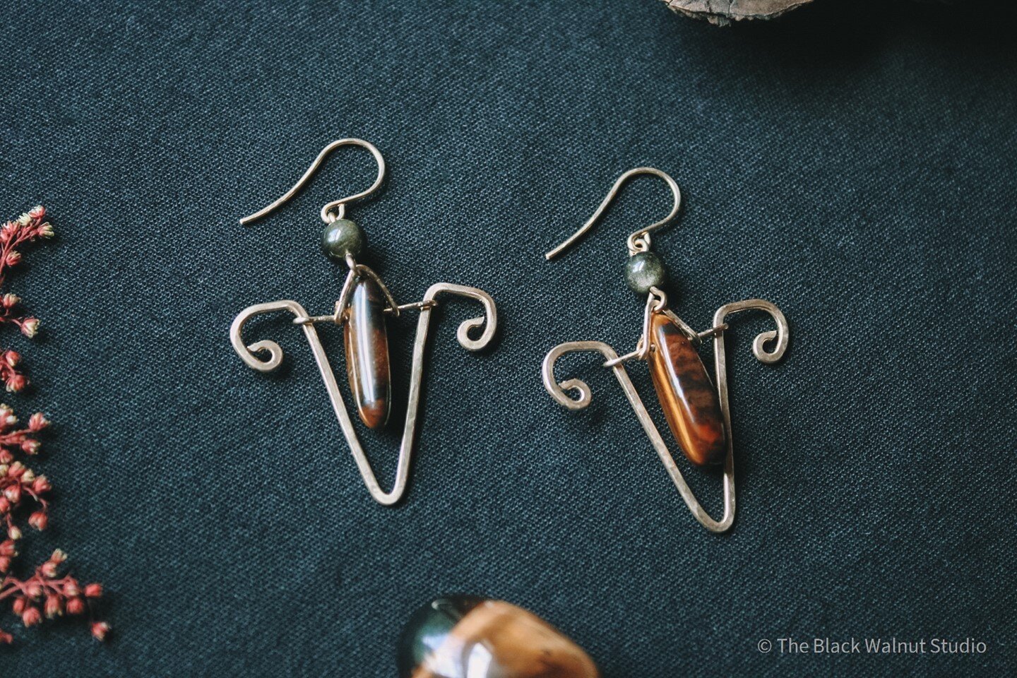 ▪️◾Goddess Earrings!!◾▪️⁠
Inspired by the Hindu goddess Durga, these earrings are made with Tiger's Eye and Gold Sheen Obsidian.⁠
According to legend, Durga was created by other gods to slay the demon Mahisasura. She is usually depicted riding a tige