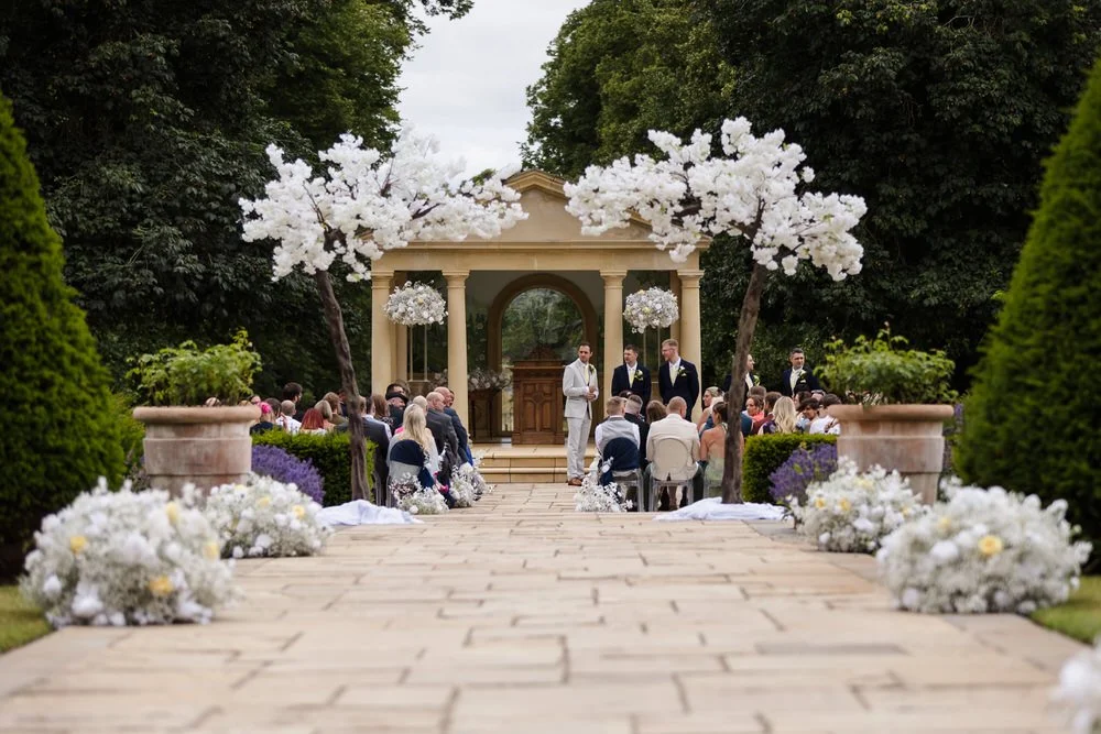 Groom and groomsmen waiting at the ceremony as guests take their seats at Rowton Castle