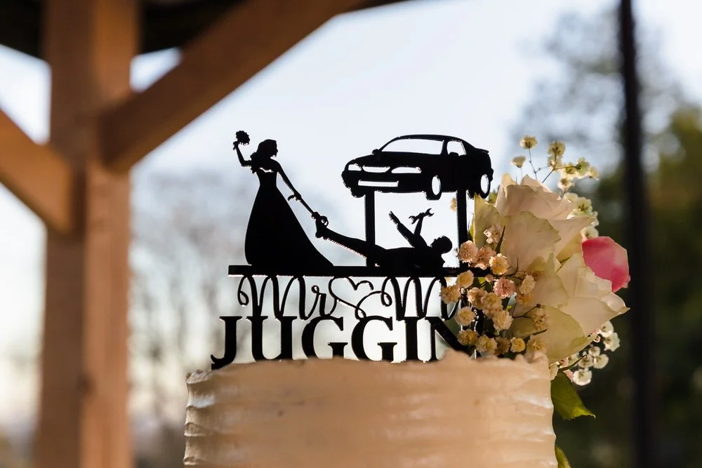 Custom wedding cake topper with car design at Bredenbury Court Barns