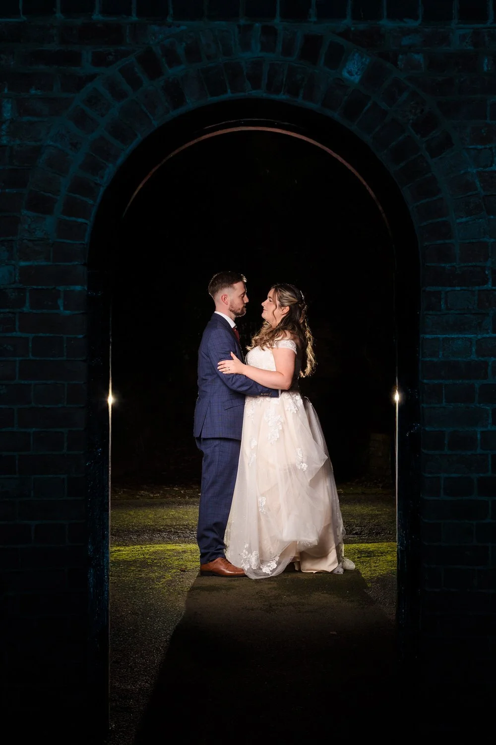 Dramatic evening portrait with creative lighting Bredenbury Court Barns Herefordshire