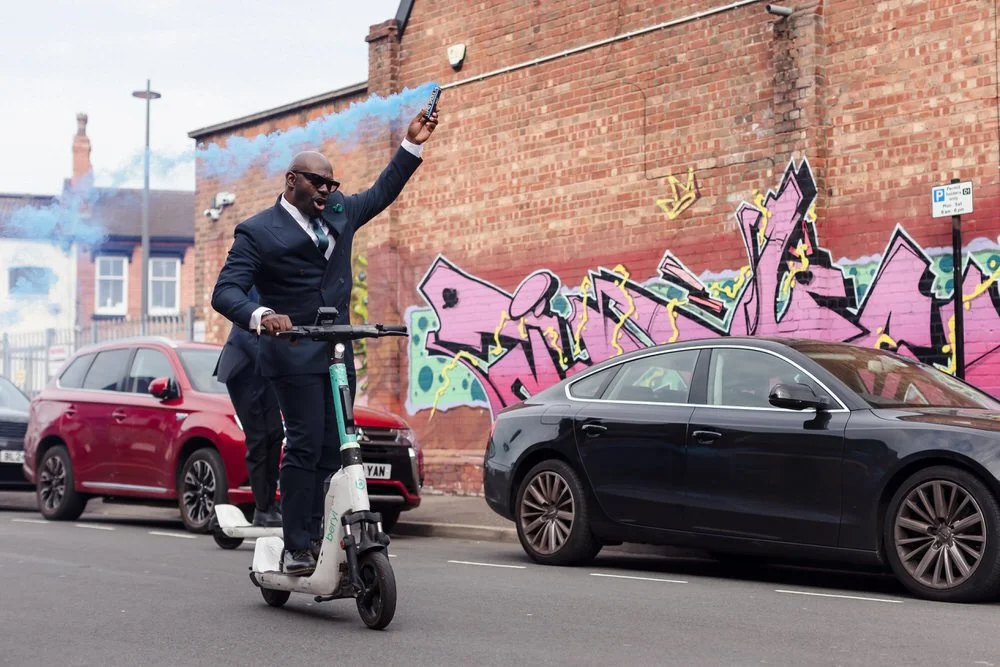 groomsmen arrive at Birmingham wedding in digbeth on scooters with smoke bombs