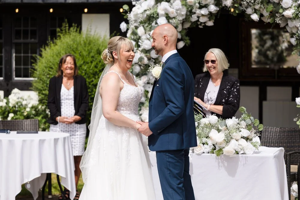 Guests during an emotional moment at an outdoor ceremony at Hogarths Stone Manor