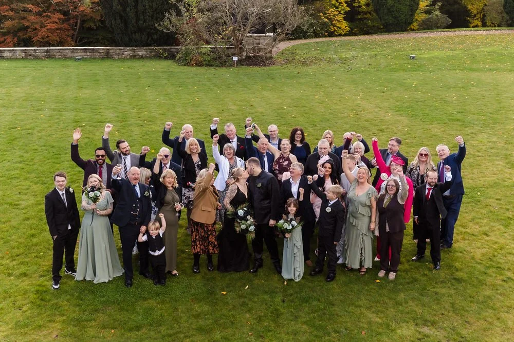 Full wedding party group photo on autumn lawn at Arley House Gardens, family wedding photography by Once in a Lifetime Photography Worcestershire