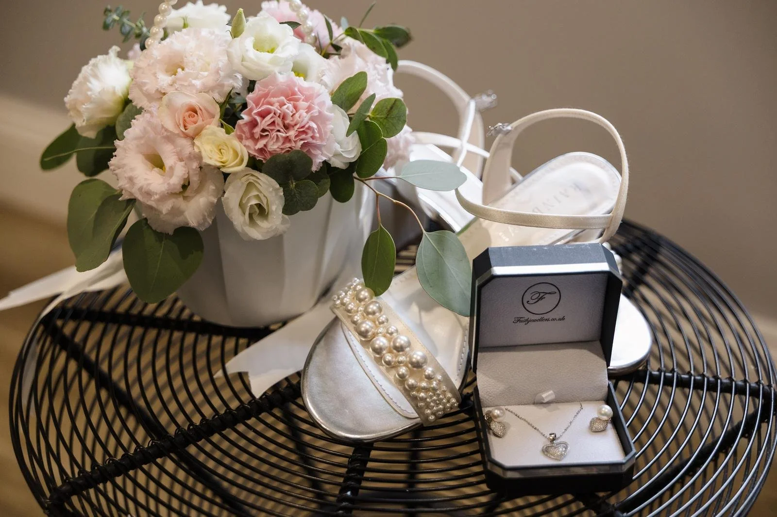 Bridal flat lay with flowers, shoes and jewellery at Ashton Lodge Country House wedding photography by Once in a Lifetime Photography