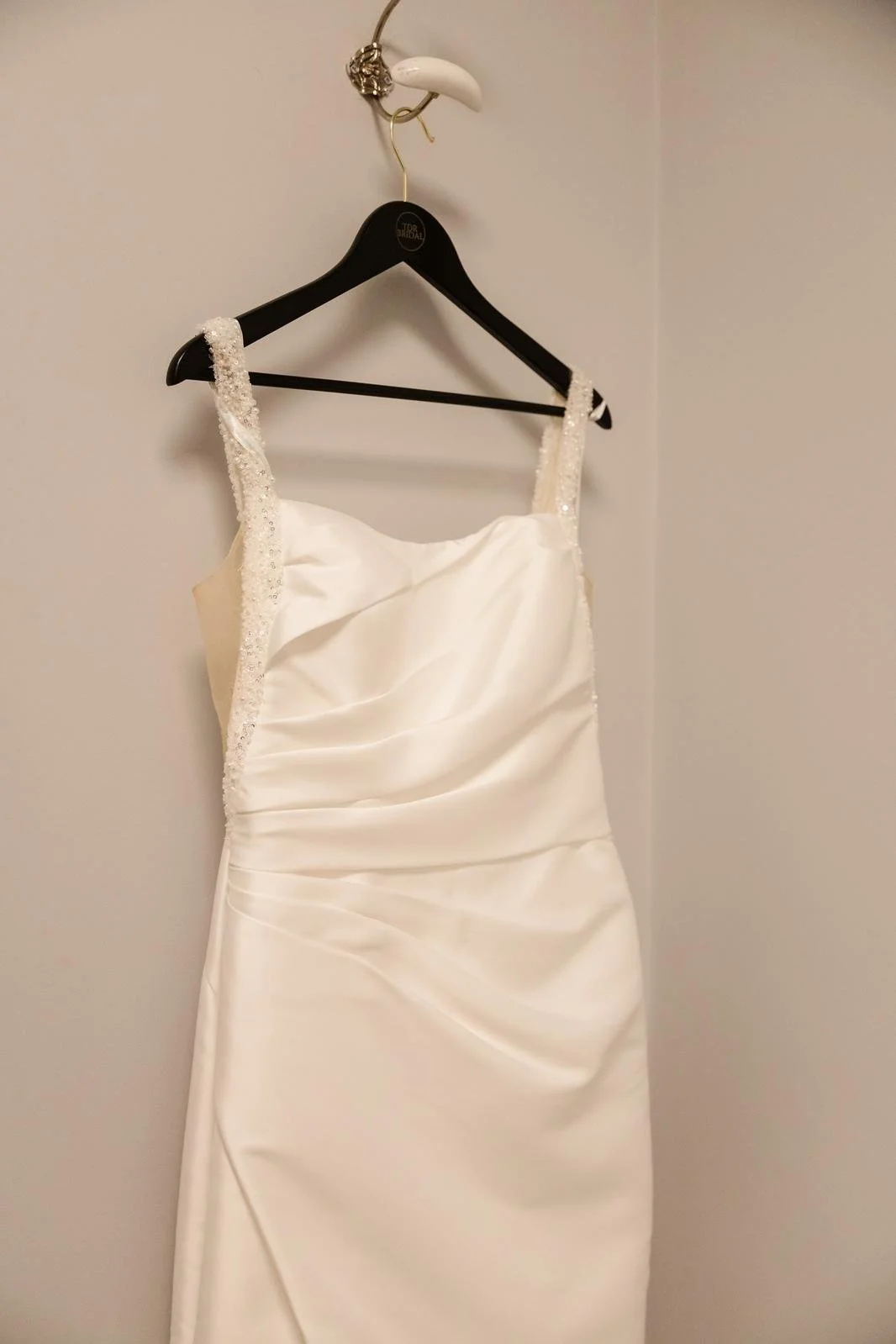 Wedding dress detail hanging before the bride got dressed at Ashton Lodge Country House wedding photography by Once in a Lifetime Photography