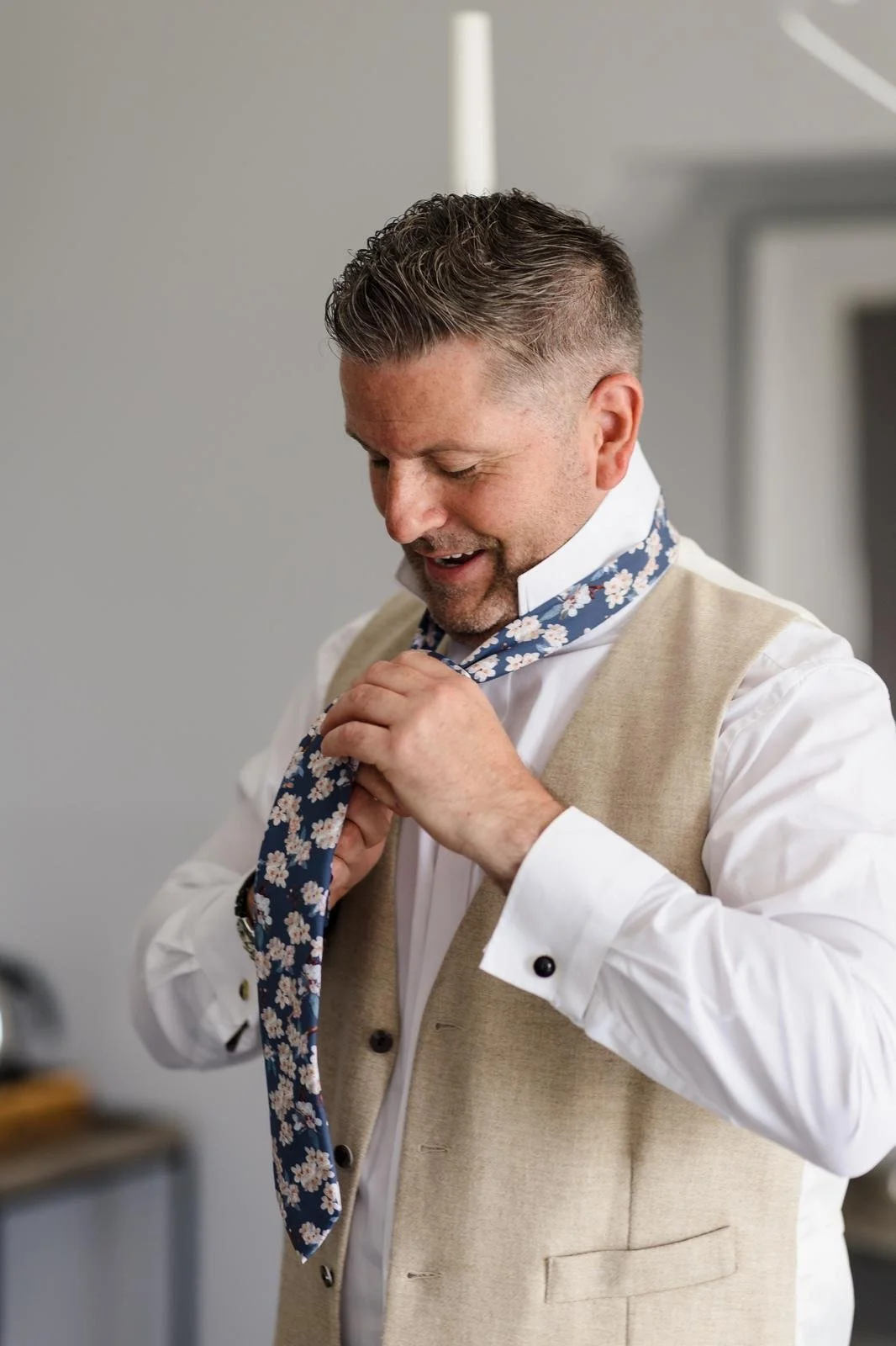 Groom adjusting his tie before the ceremony at Ashton Lodge Country House wedding photography by Once in a Lifetime Photography