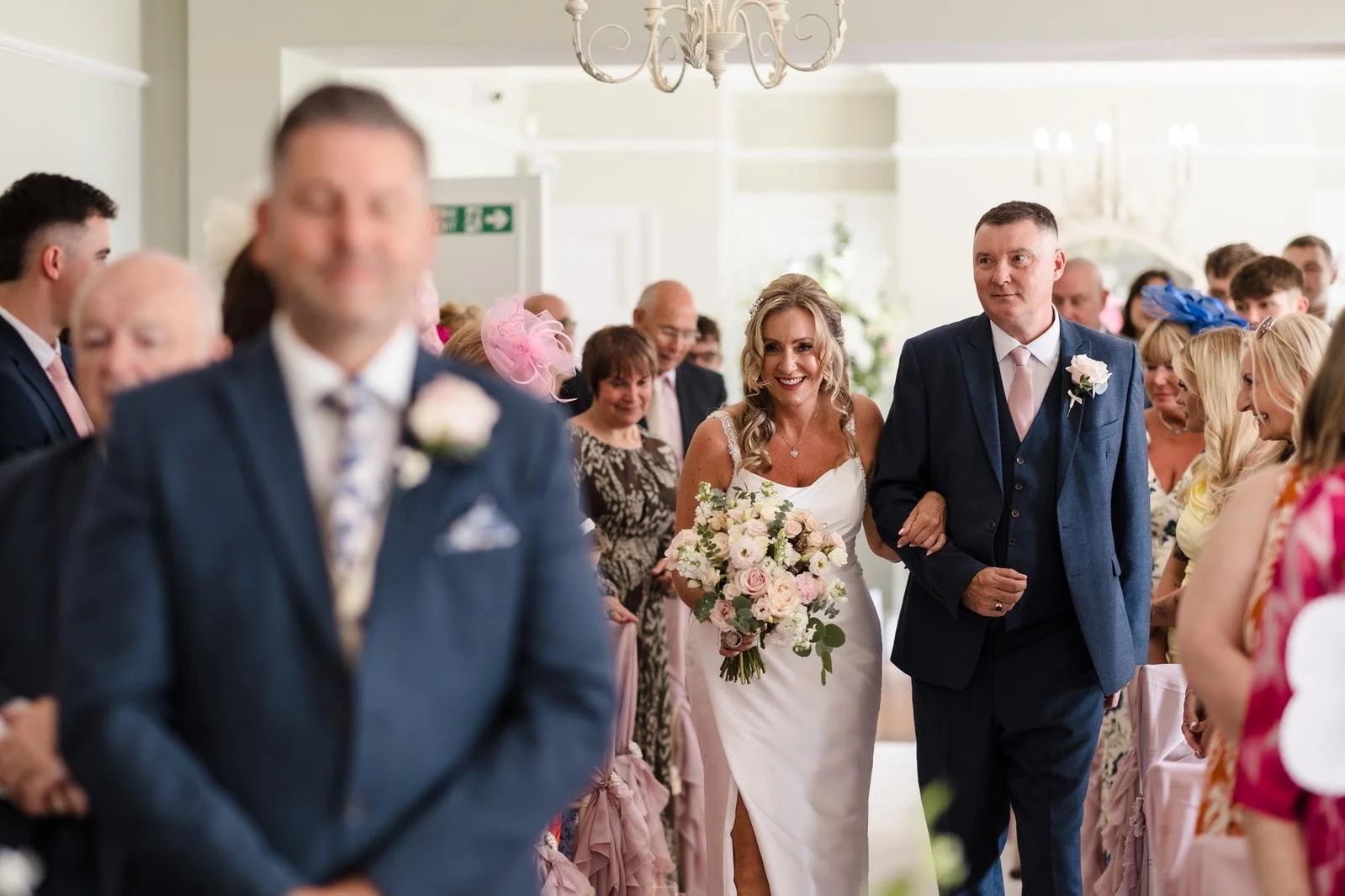 Guests arriving for the ceremony at Ashton Lodge Country House wedding photography by Once in a Lifetime Photography
