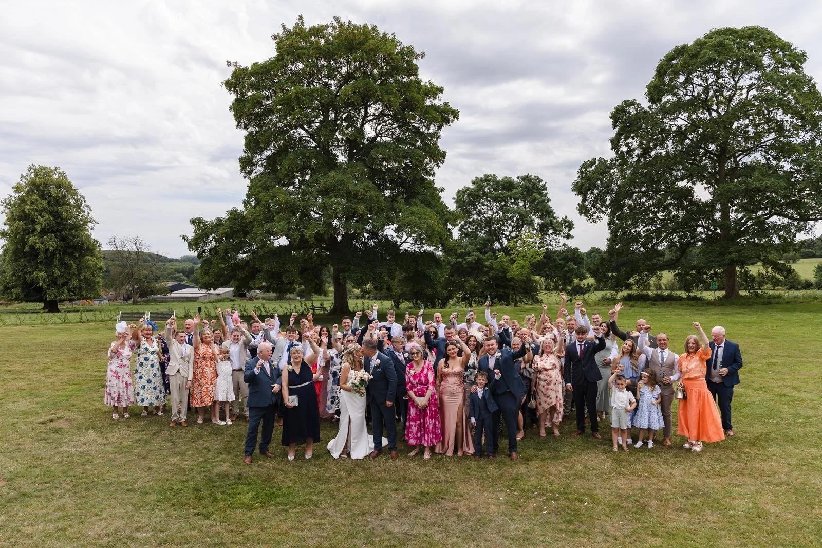 Large group photograph on the lawn at Ashton Lodge Country House wedding photography by Once in a Lifetime Photography