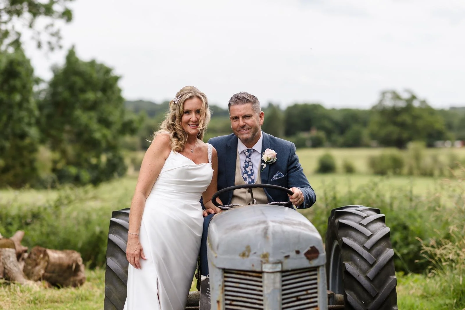 Close-up portrait of Charlotte and Richard by the old tractor at Ashton Lodge Country House wedding photography by Once in a Lifetime Photography