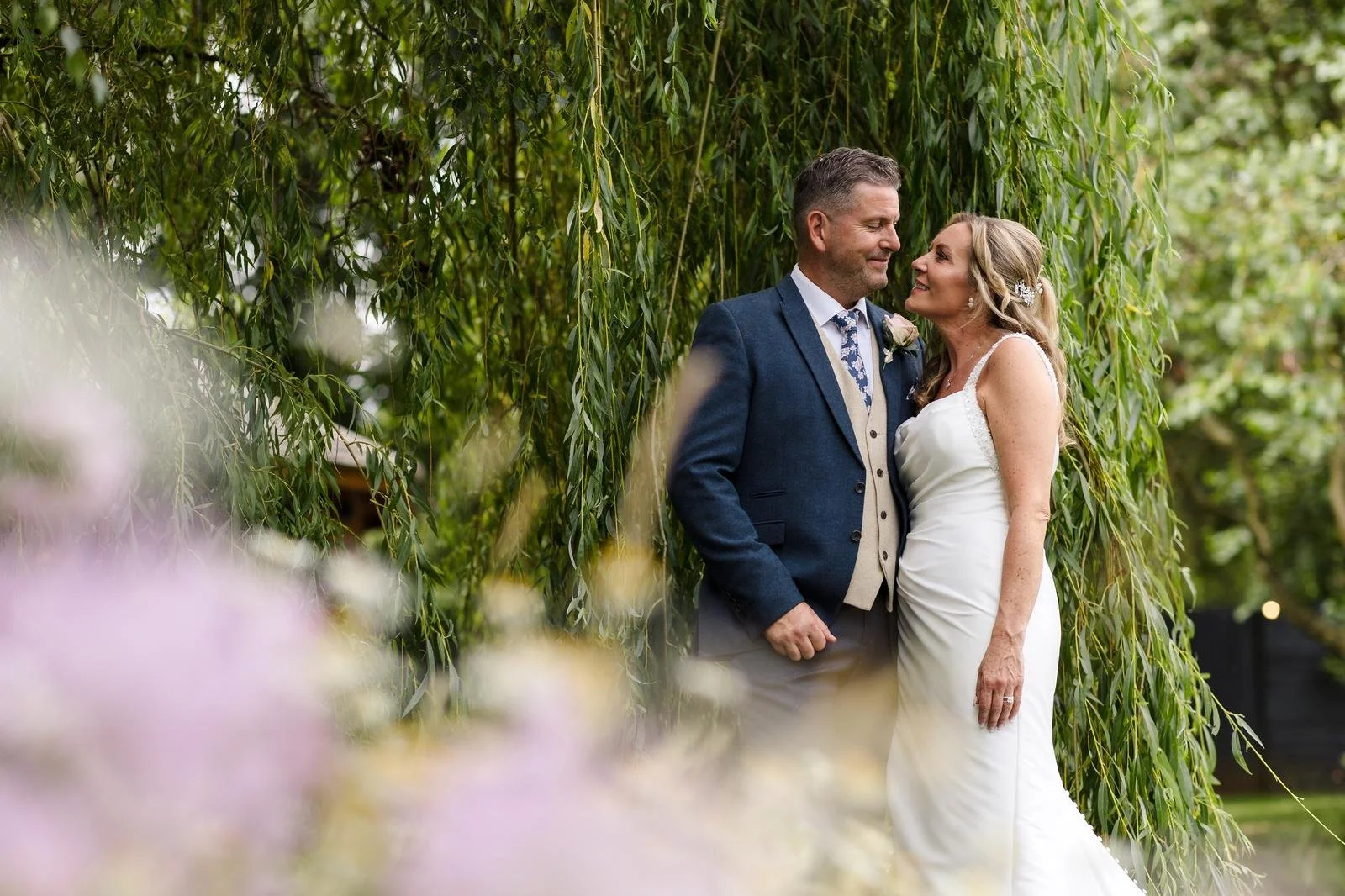 Charlotte and Richard's portrait at the hedge wall at Ashton Lodge Country House wedding photography by Once in a Lifetime Photography