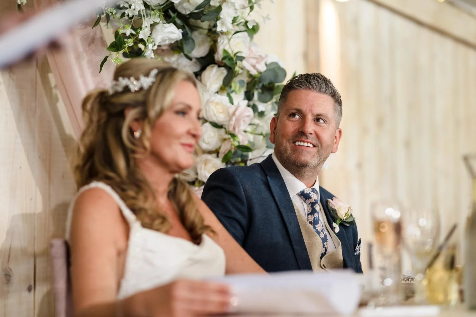 Guests reading the order of the day card at Ashton Lodge Country House wedding photography by Once in a Lifetime Photography