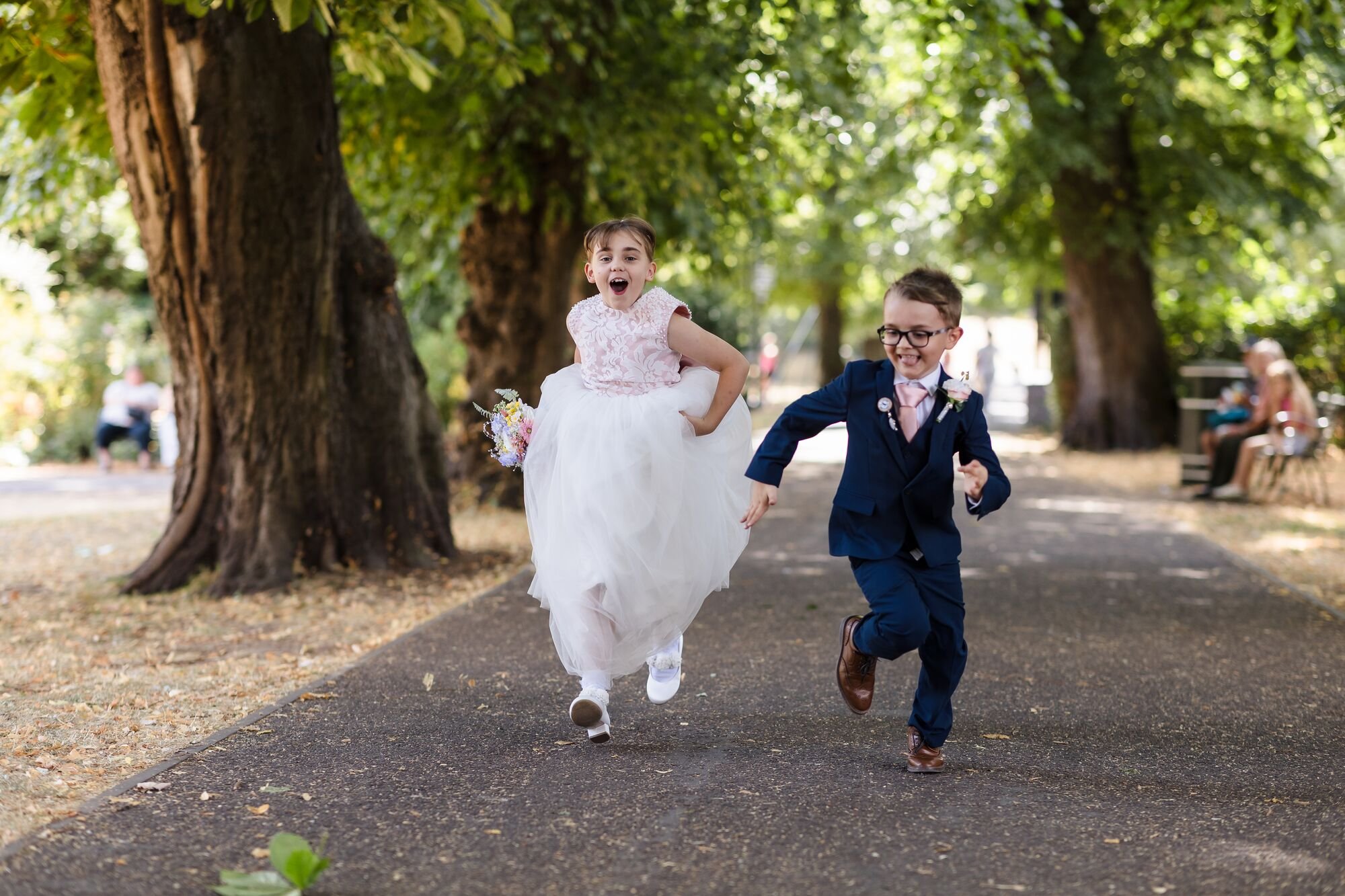 lichfield-registry-office-wedding-children-running-tree-lined-path.jpg