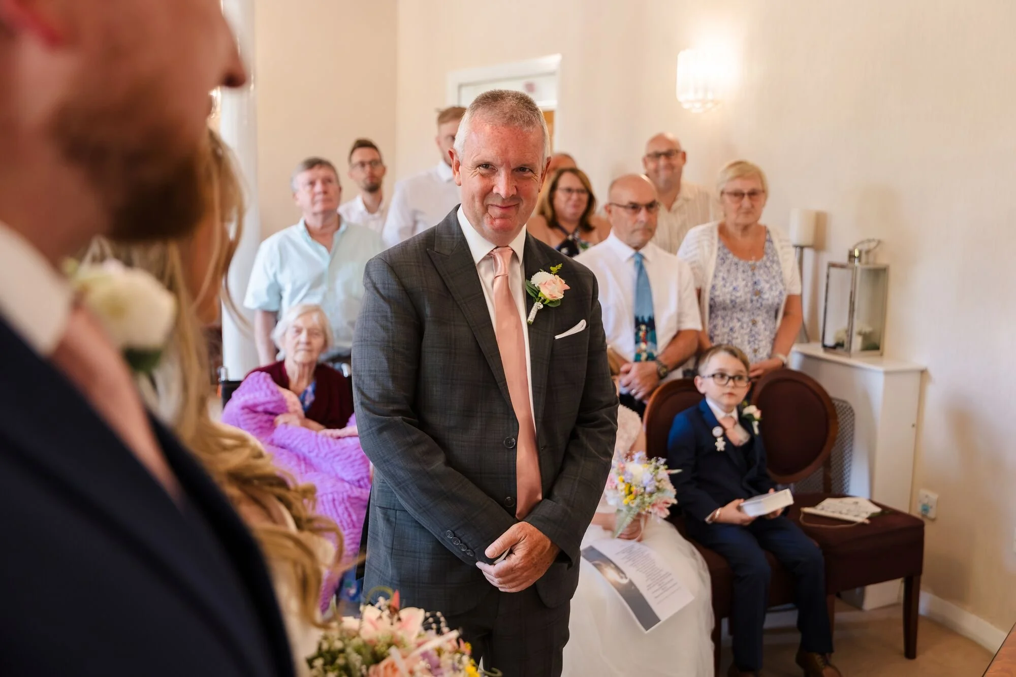 lichfield-registry-office-wedding-guests-watch-bride-enter.jpg