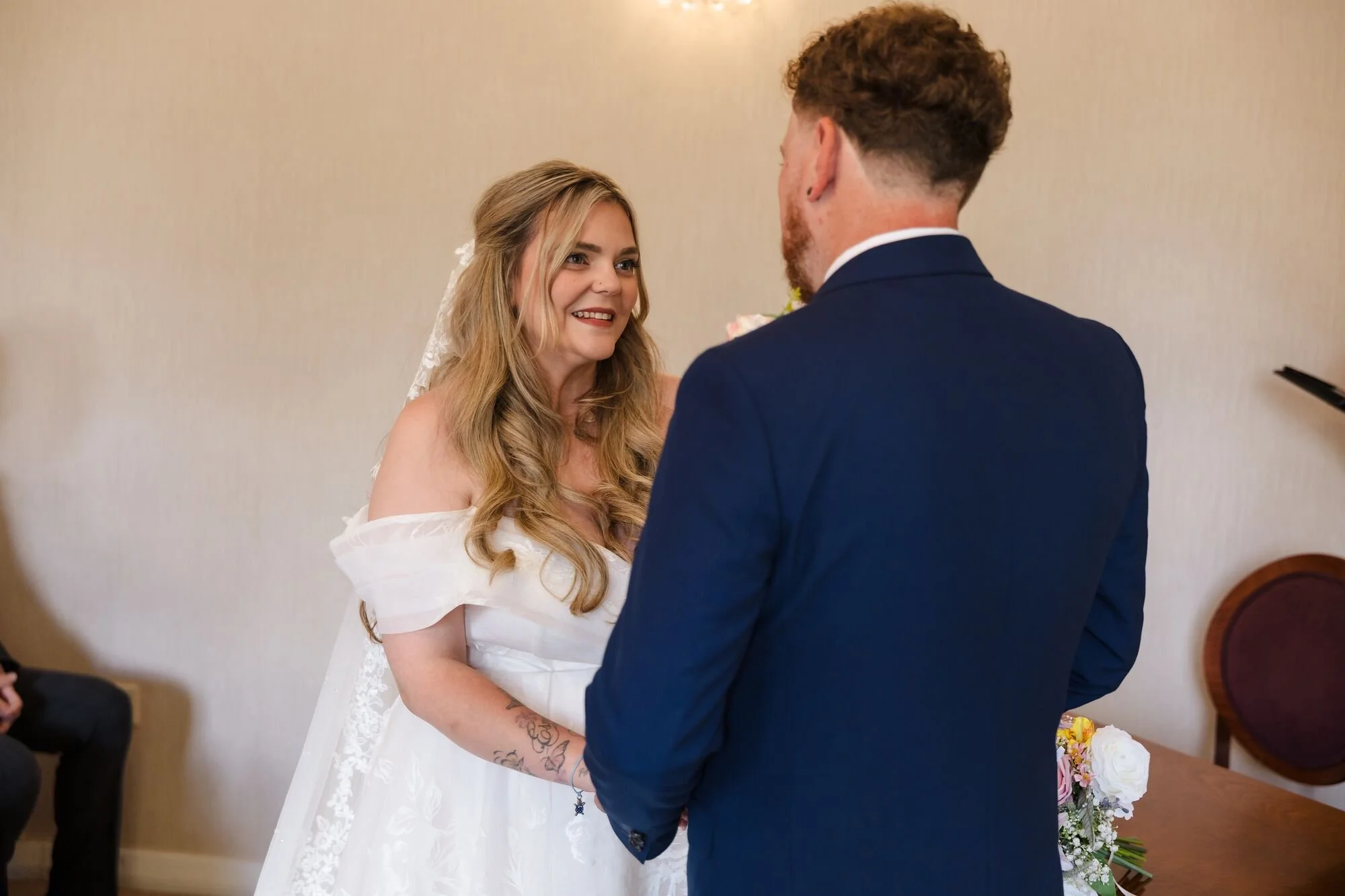 lichfield-registry-office-wedding-vows-holding-hands.jpg