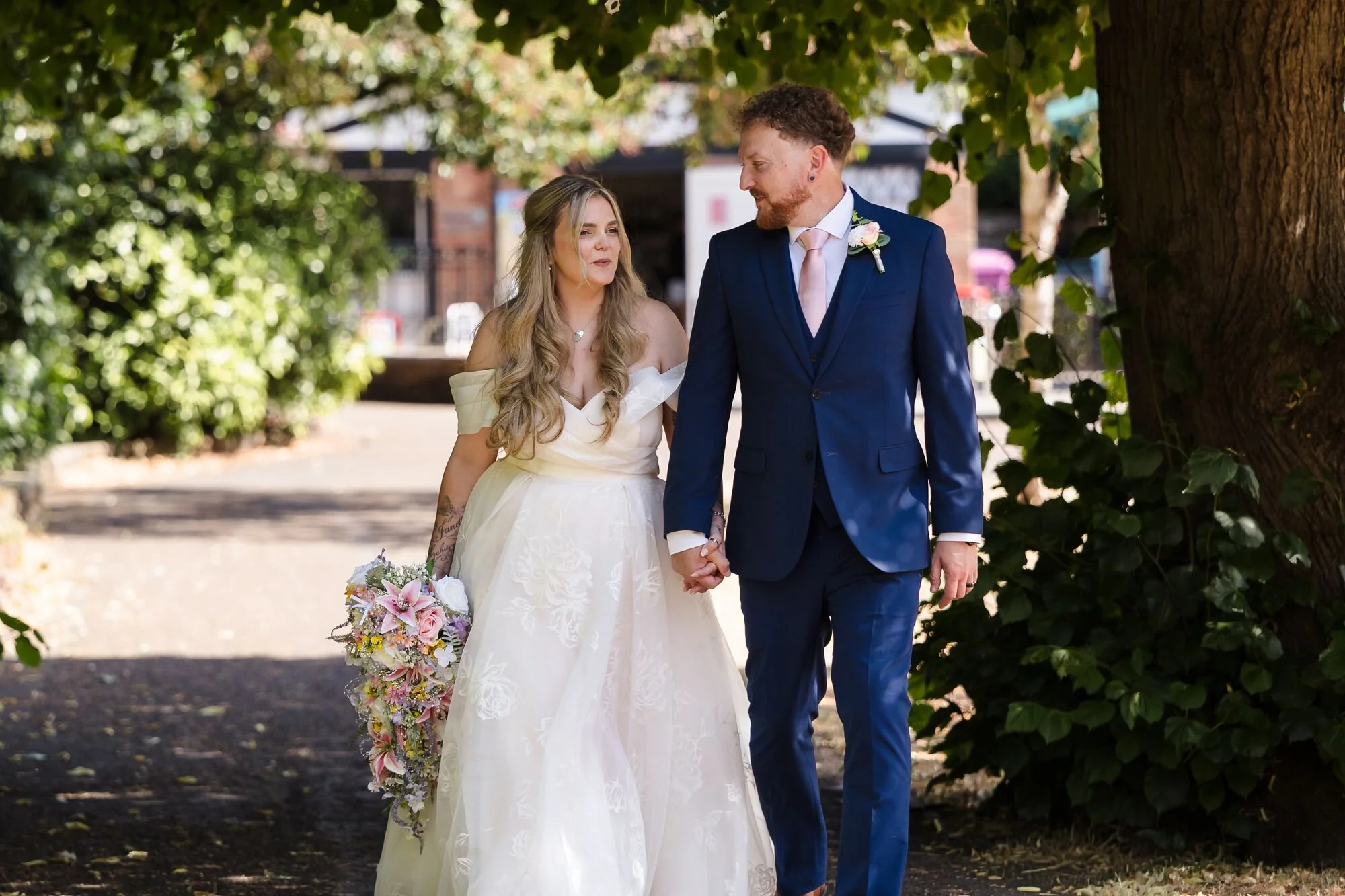 lichfield-registry-office-wedding-couple-walking-hand-in-hand.jpg