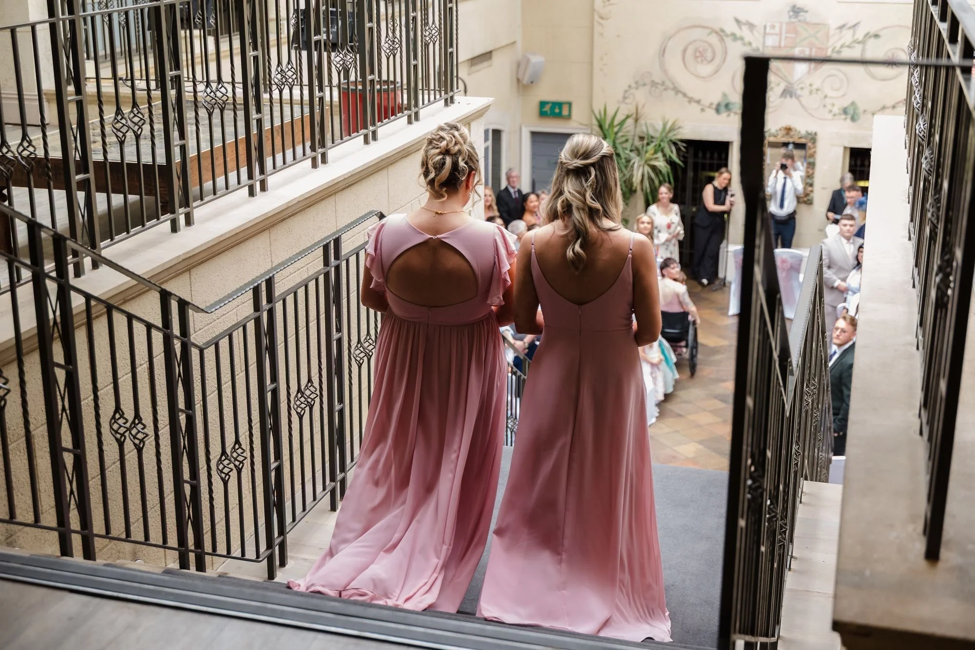 bridesmaids-top-of-ceremony-staircase-guests-below.jpg