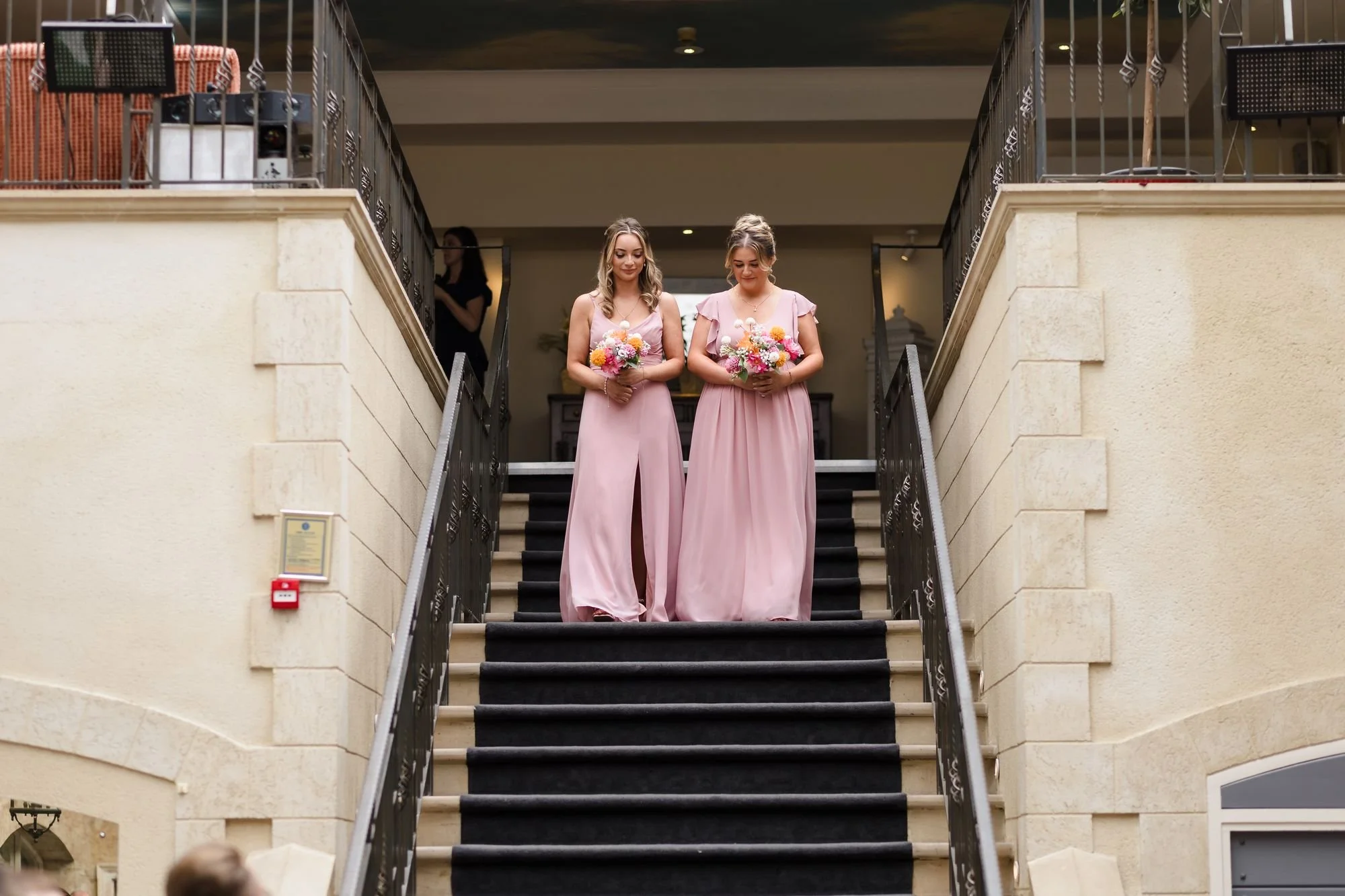 bridesmaids-descending-ceremony-staircase-nailcote-hall.jpg