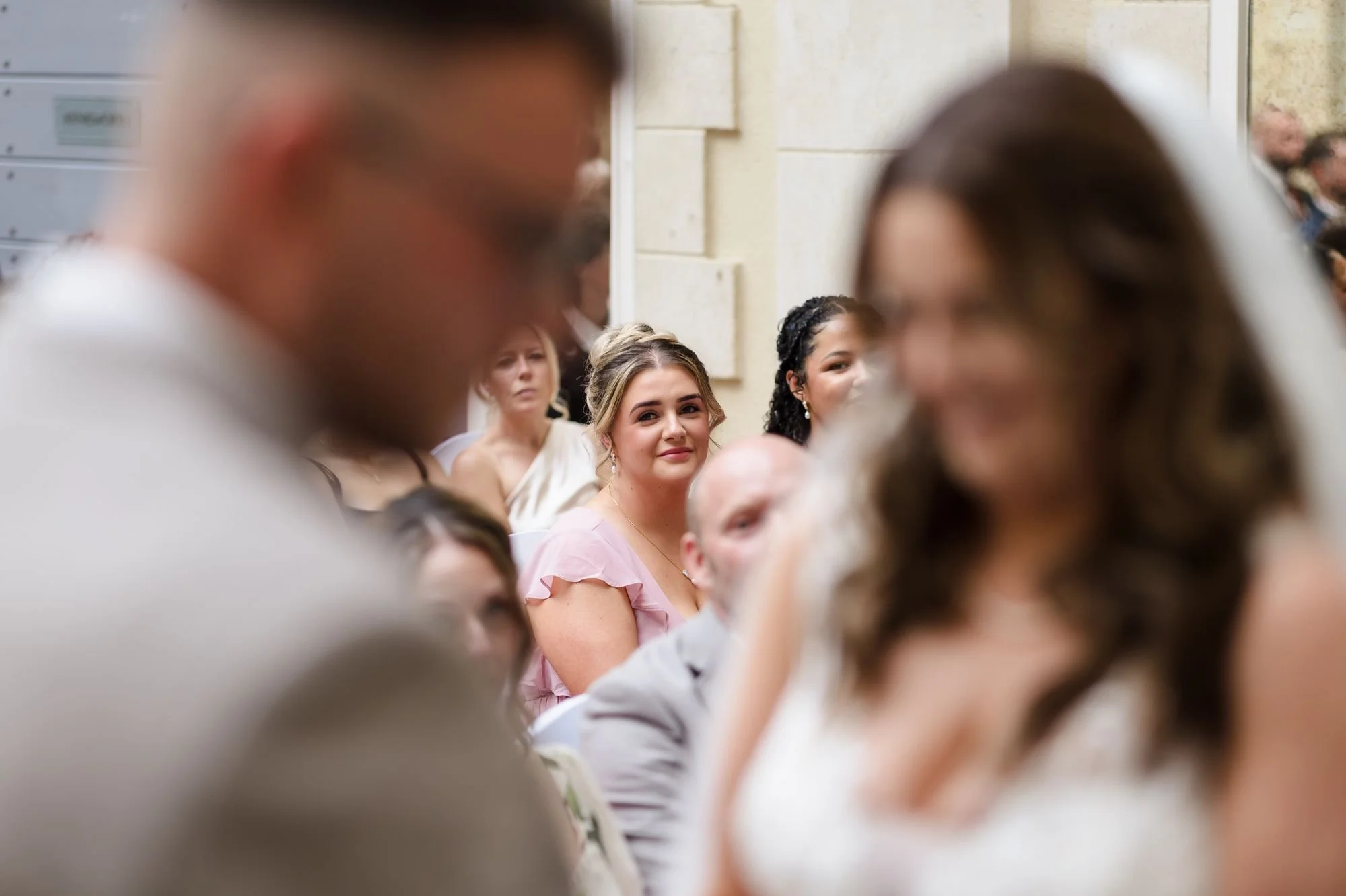 bridesmaid-watching-wedding-vows.jpg