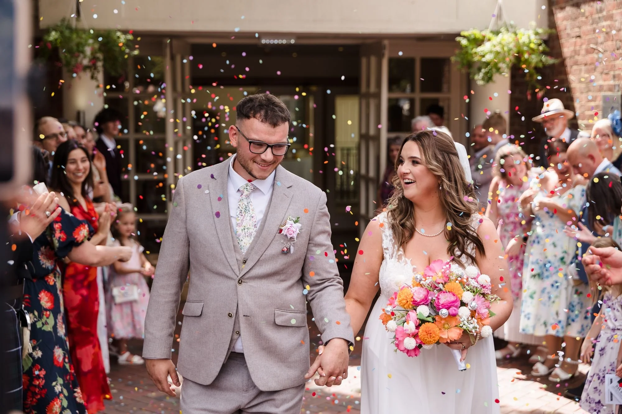holly-and-dan-laughing-through-confetti.jpg