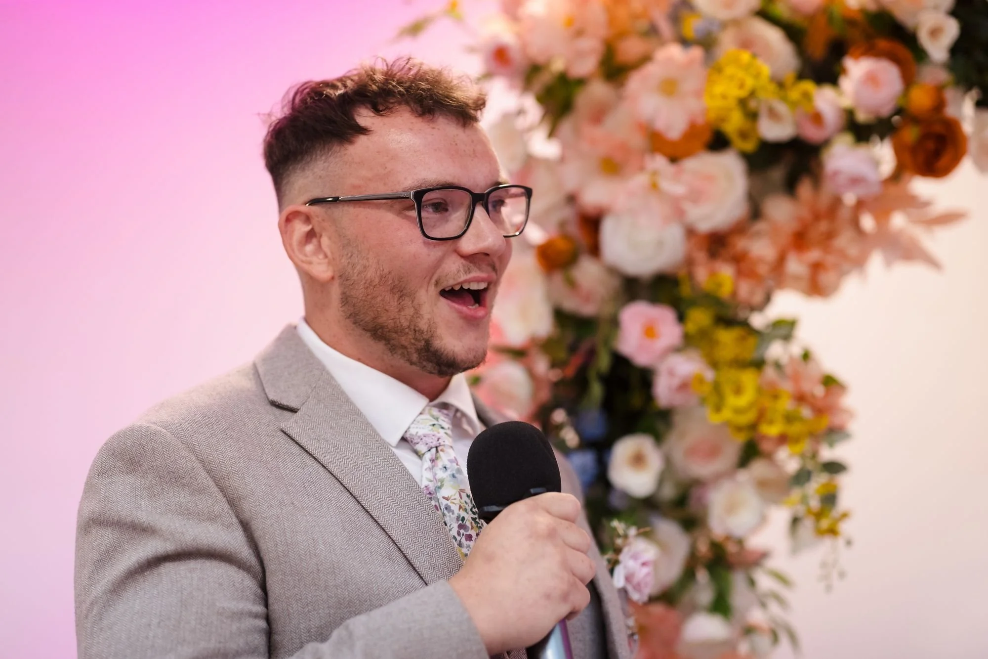 groom-dan-laughing-speech-microphone.jpg