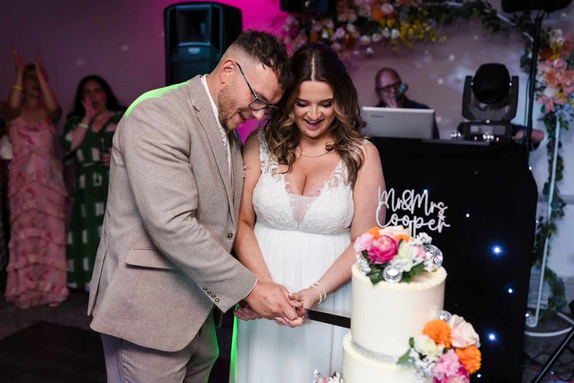 holly-and-dan-cutting-wedding-cake.jpg
