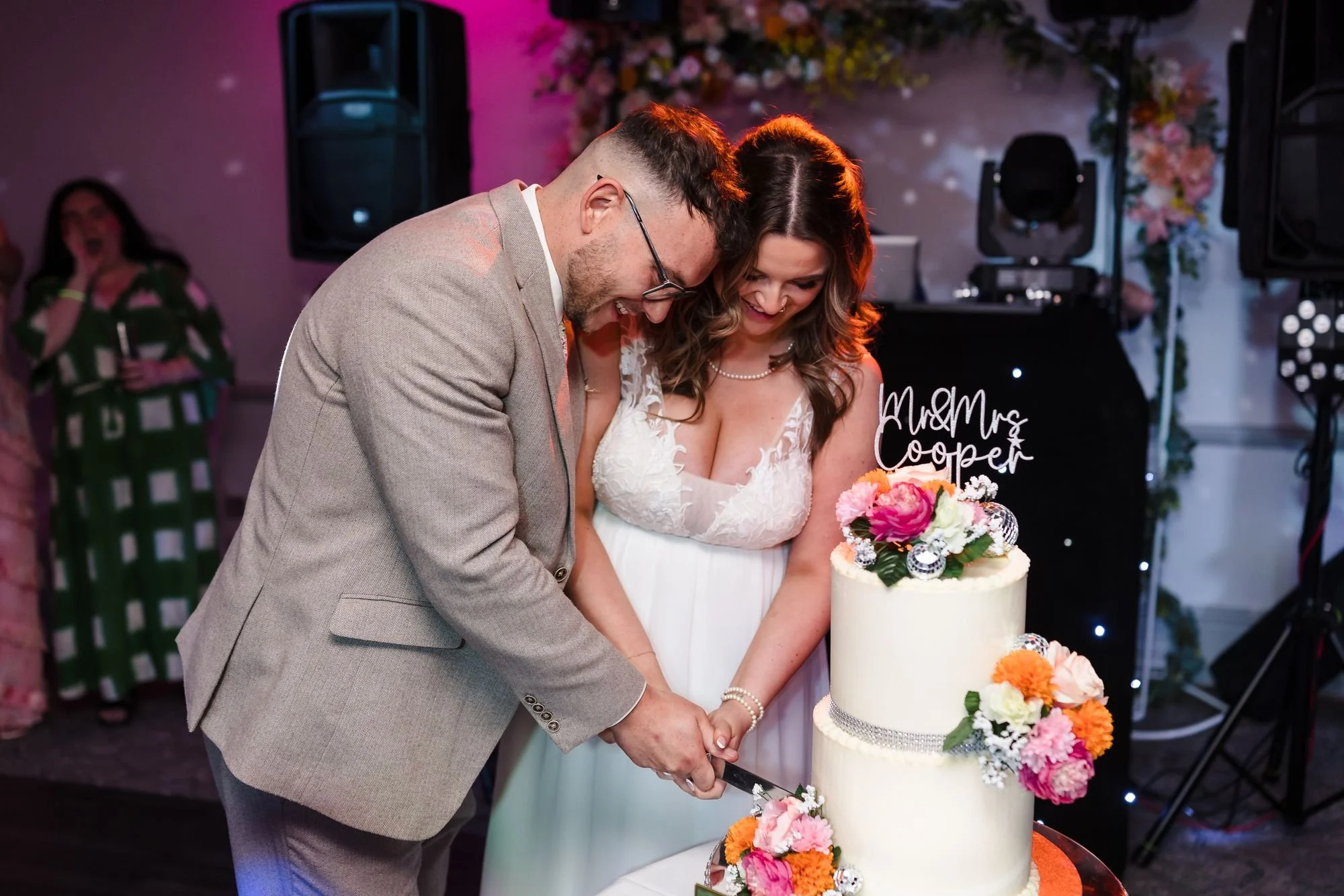 holly-and-dan-laughing-cake-cut-nailcote-hall.jpg