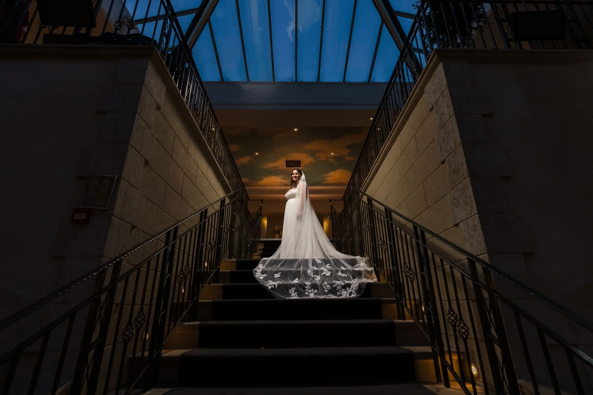 bride-holly-staircase-night-portrait-glass-roof.jpg