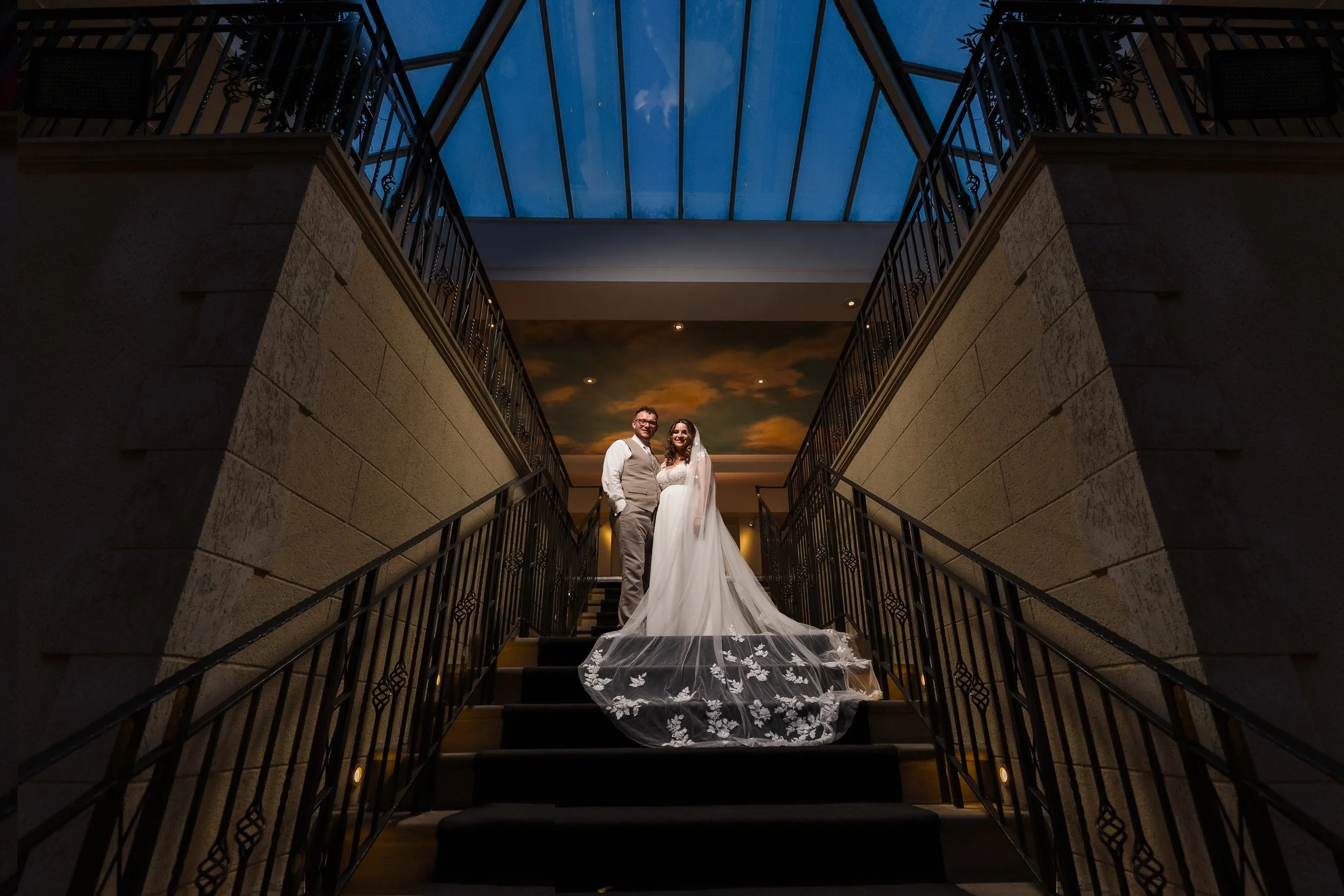holly-and-dan-staircase-night-portrait-blue-sky.jpg