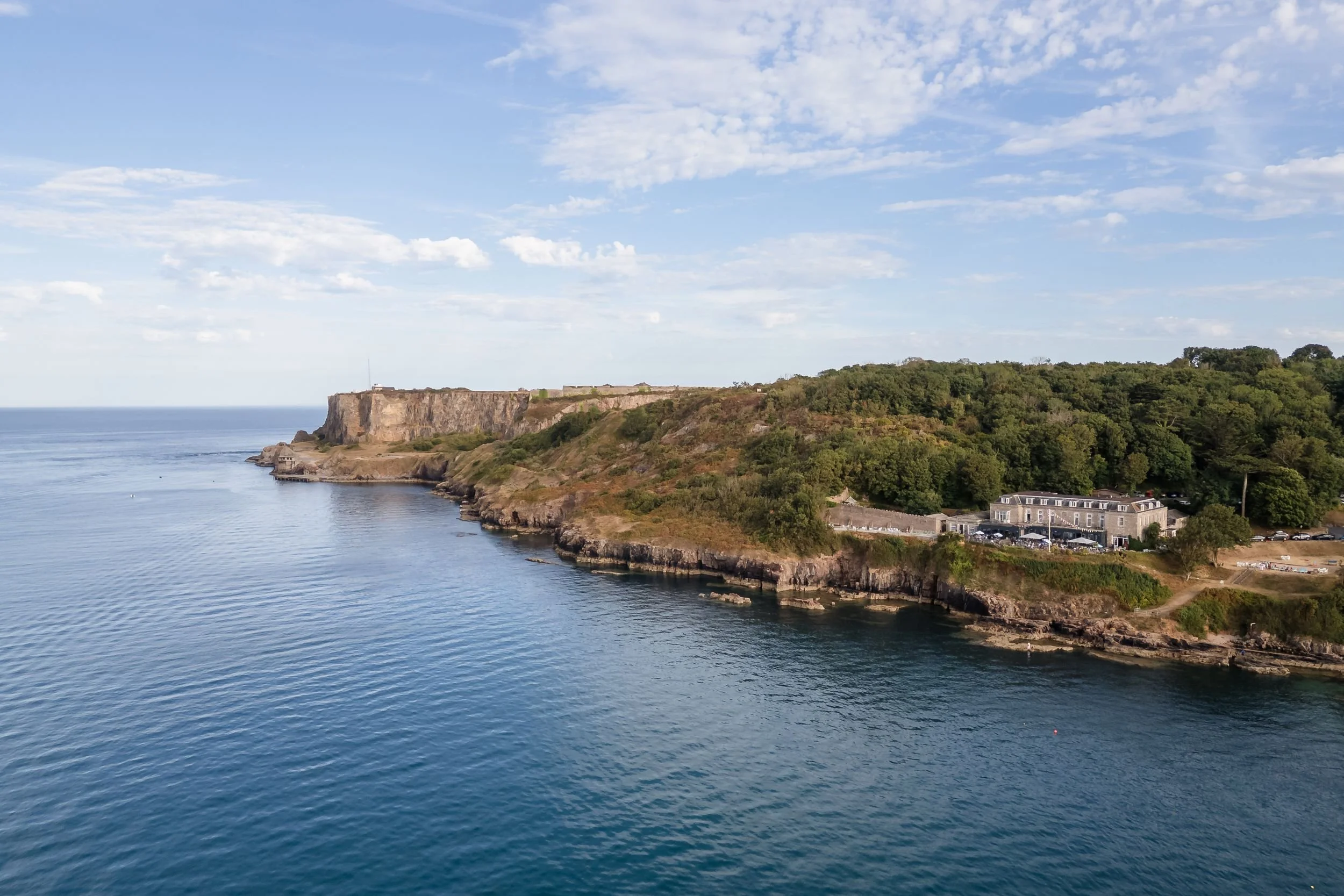 Aerial view of the Berry Head headland and Berry Head Hotel on the Brixham coastline in Devon