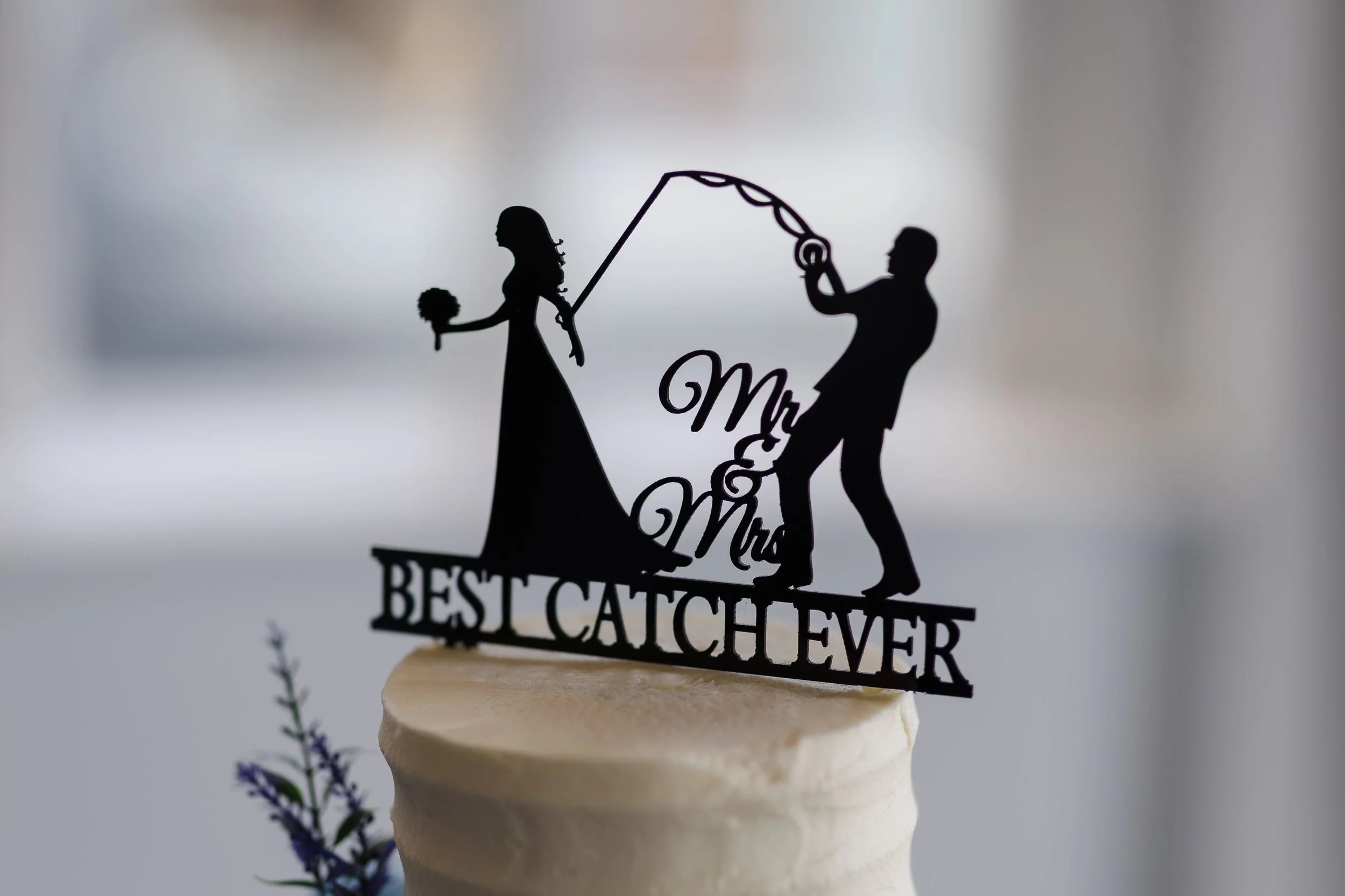 Fishing-themed wedding cake topper reading Mr and Mrs, Best Catch Ever, at a Berry Head Hotel wedding